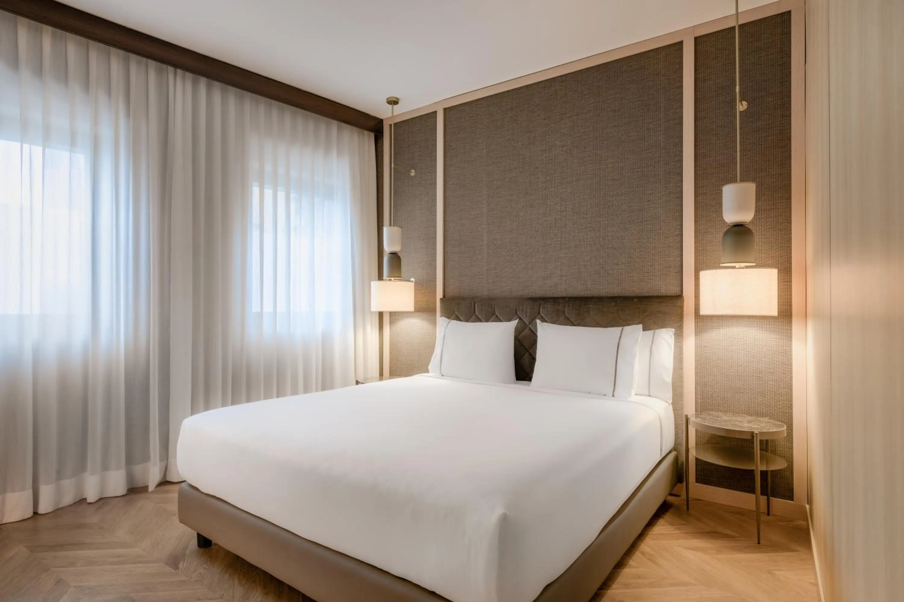 Bed in AC Hotel Milano by Marriott