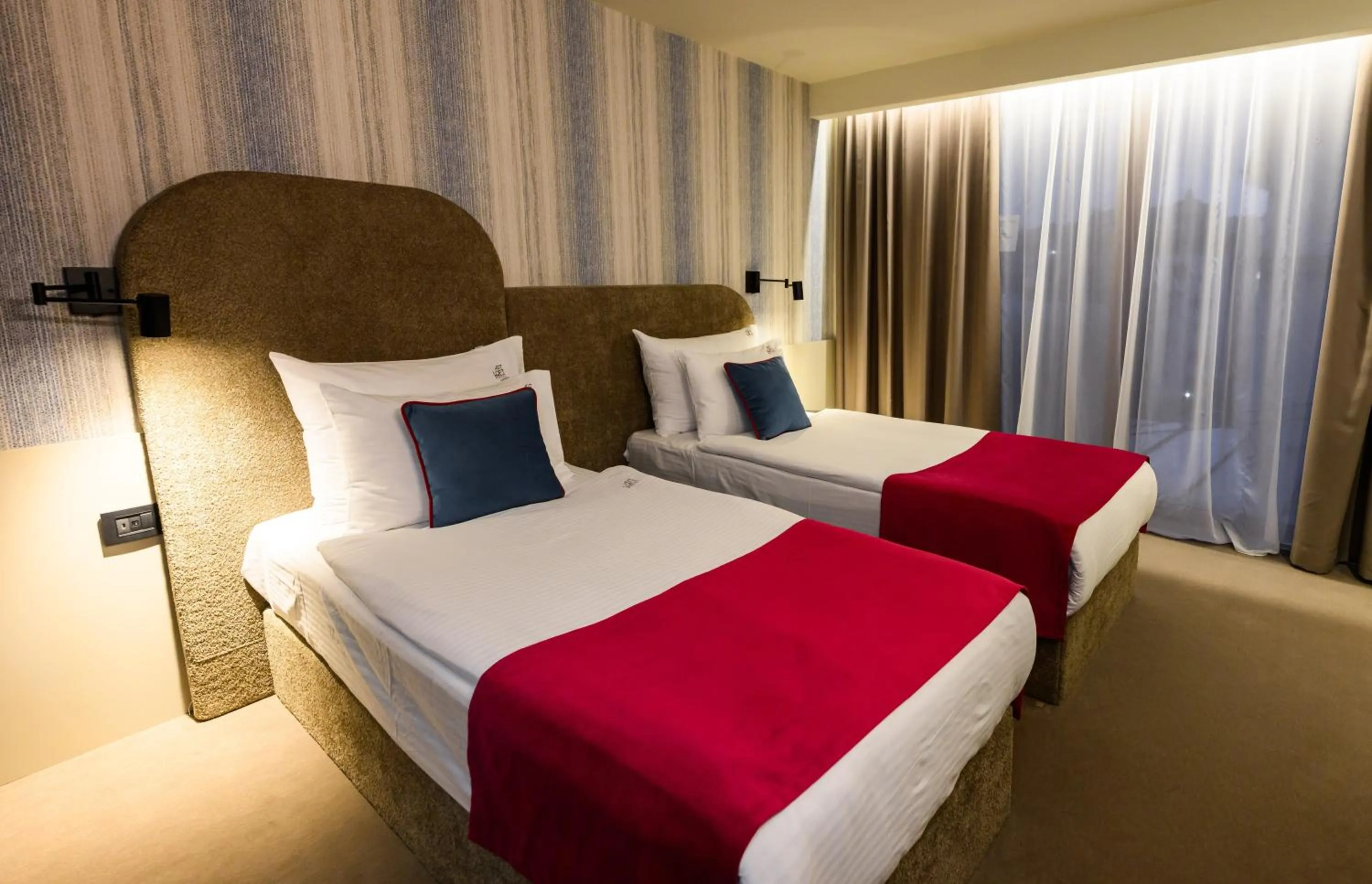 Bed in ArtLoft Garni Hotel