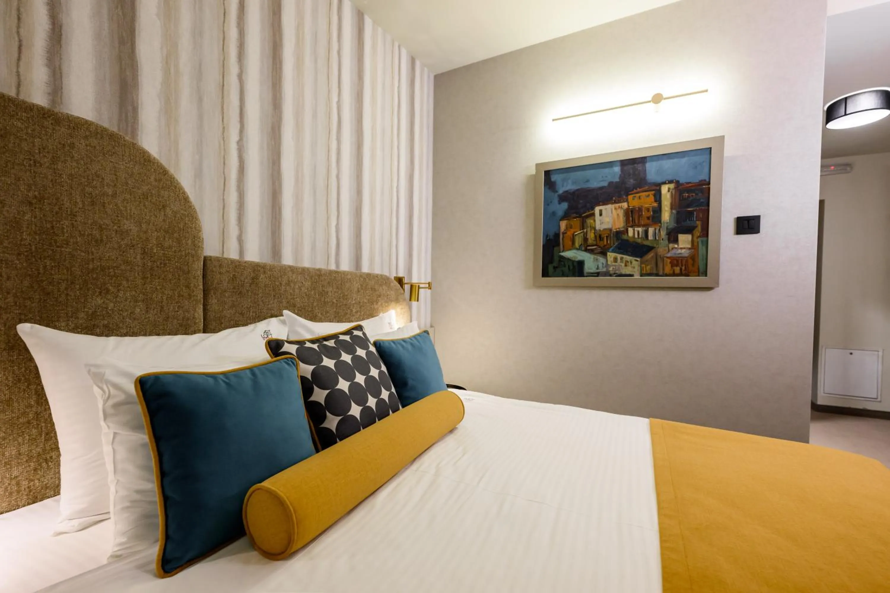 Bed in ArtLoft Garni Hotel