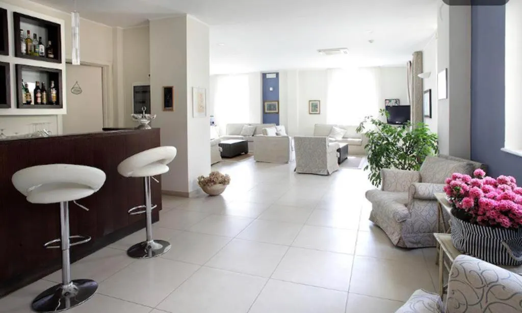 Communal lounge/ TV room in Arianna Hotel