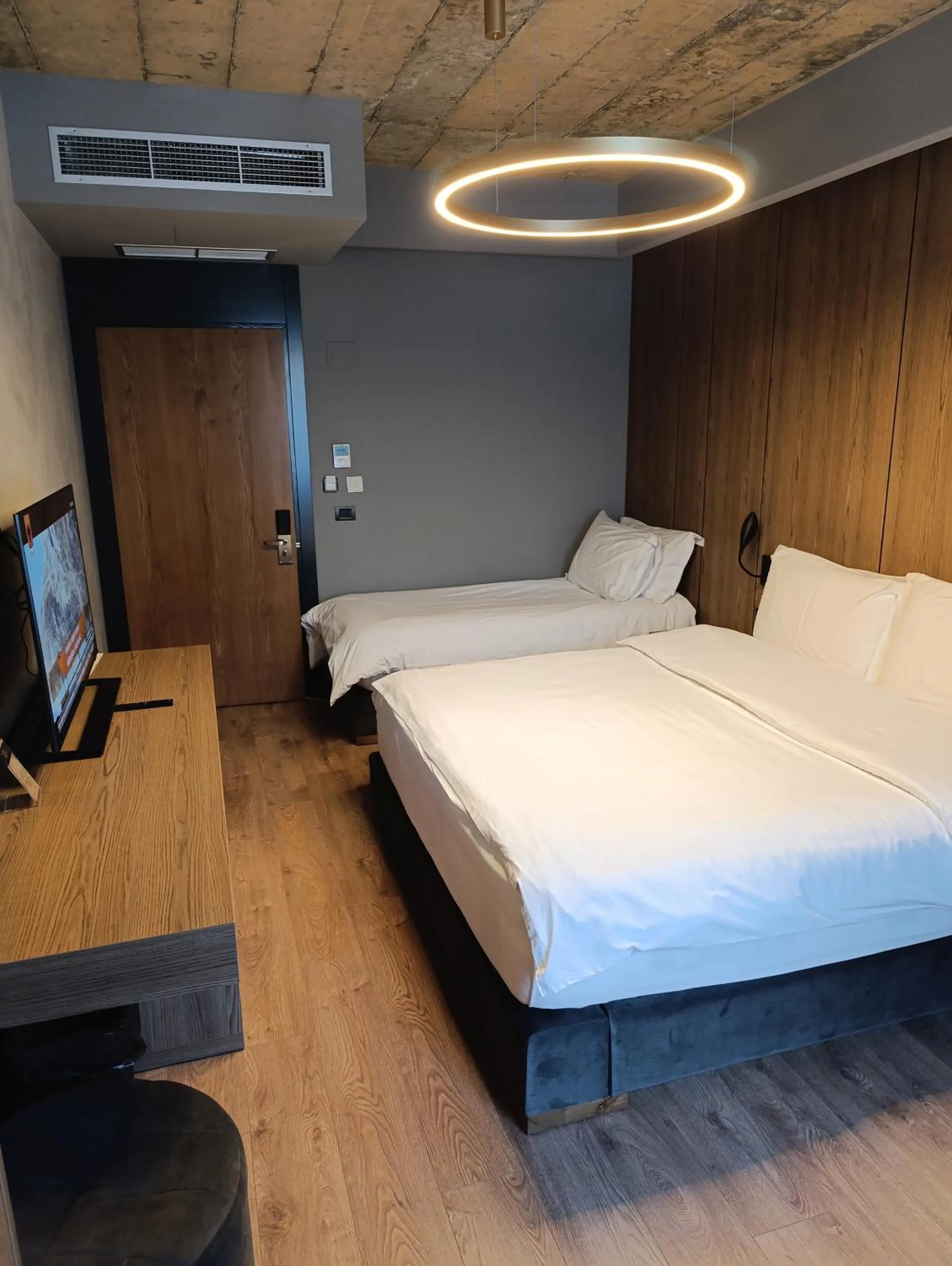 Communal lounge/ TV room, Bed in Toka Hotel Restaurant