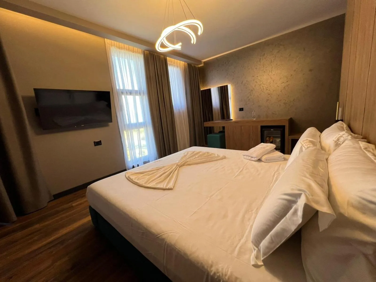 towels, Bed in Toka Hotel Restaurant