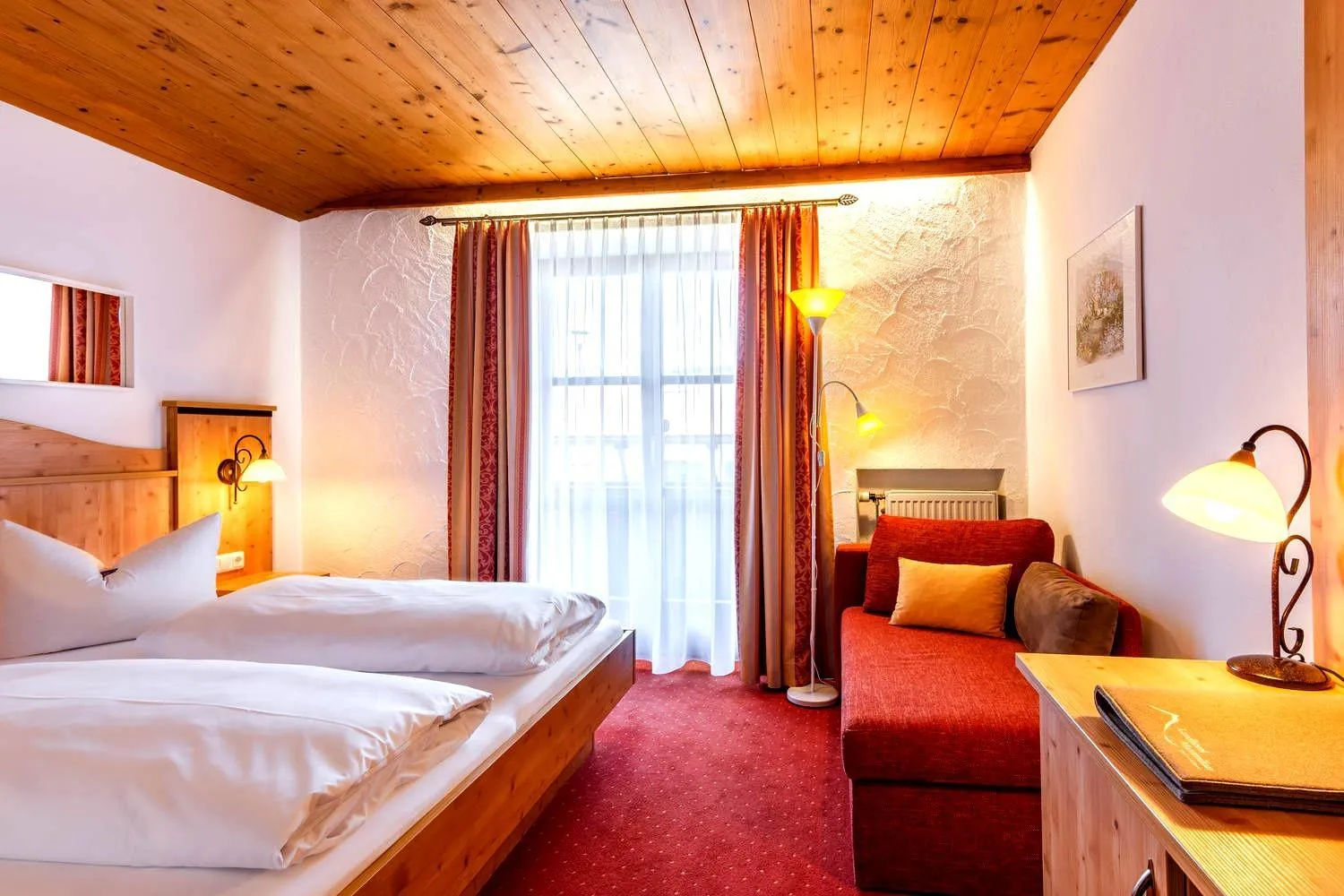 Bed in Das Maximilian - Feines Landhotel am Schliersee
