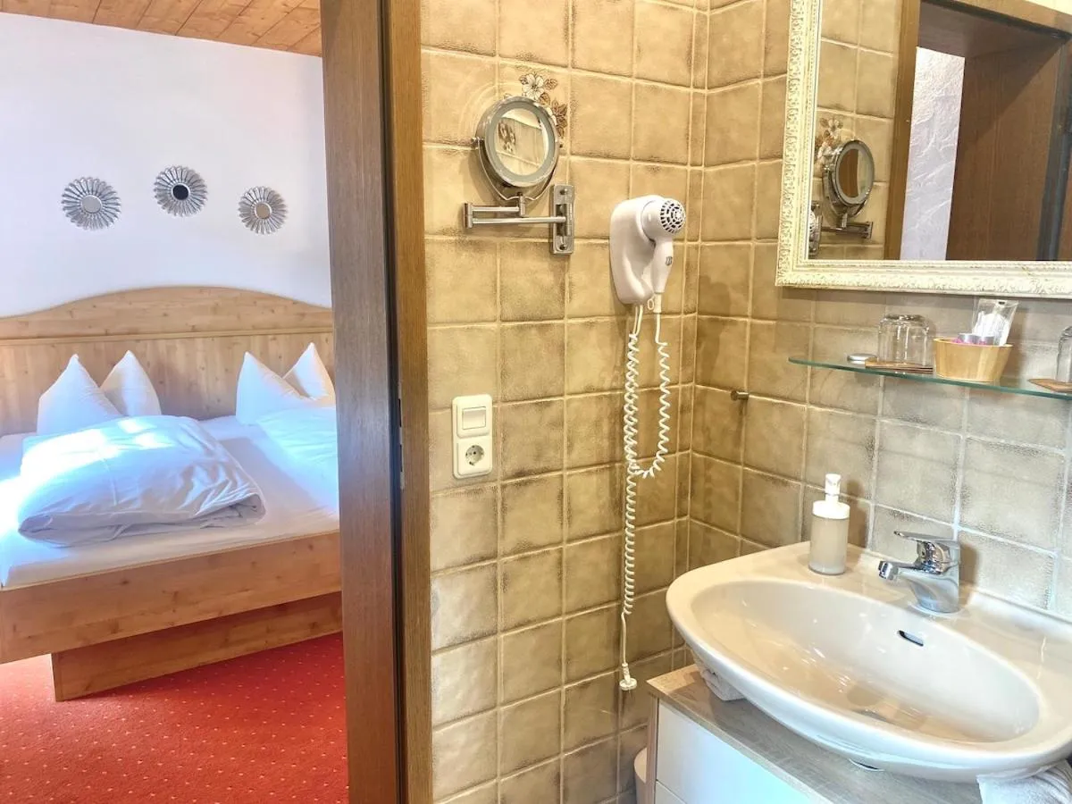 Bed in Das Maximilian - Feines Landhotel am Schliersee