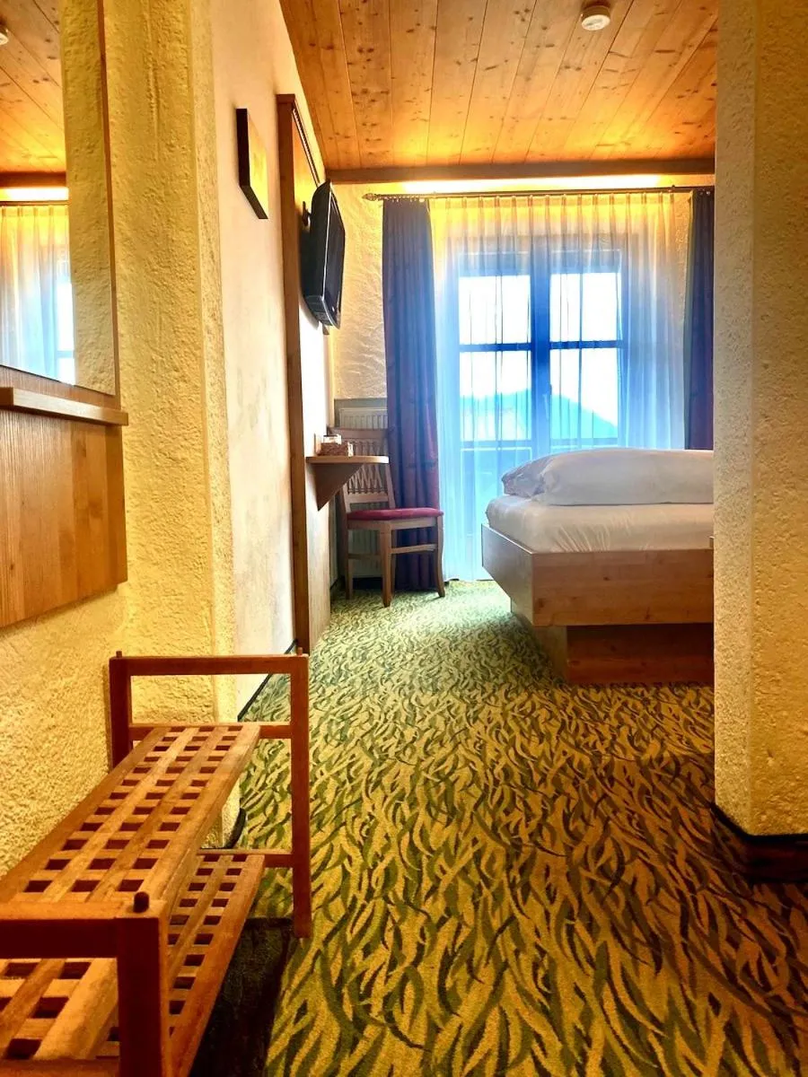 Bed in Das Maximilian - Feines Landhotel am Schliersee