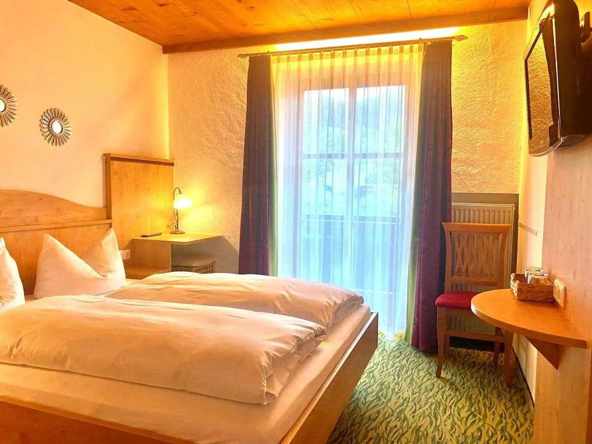 Bed in Das Maximilian - Feines Landhotel am Schliersee