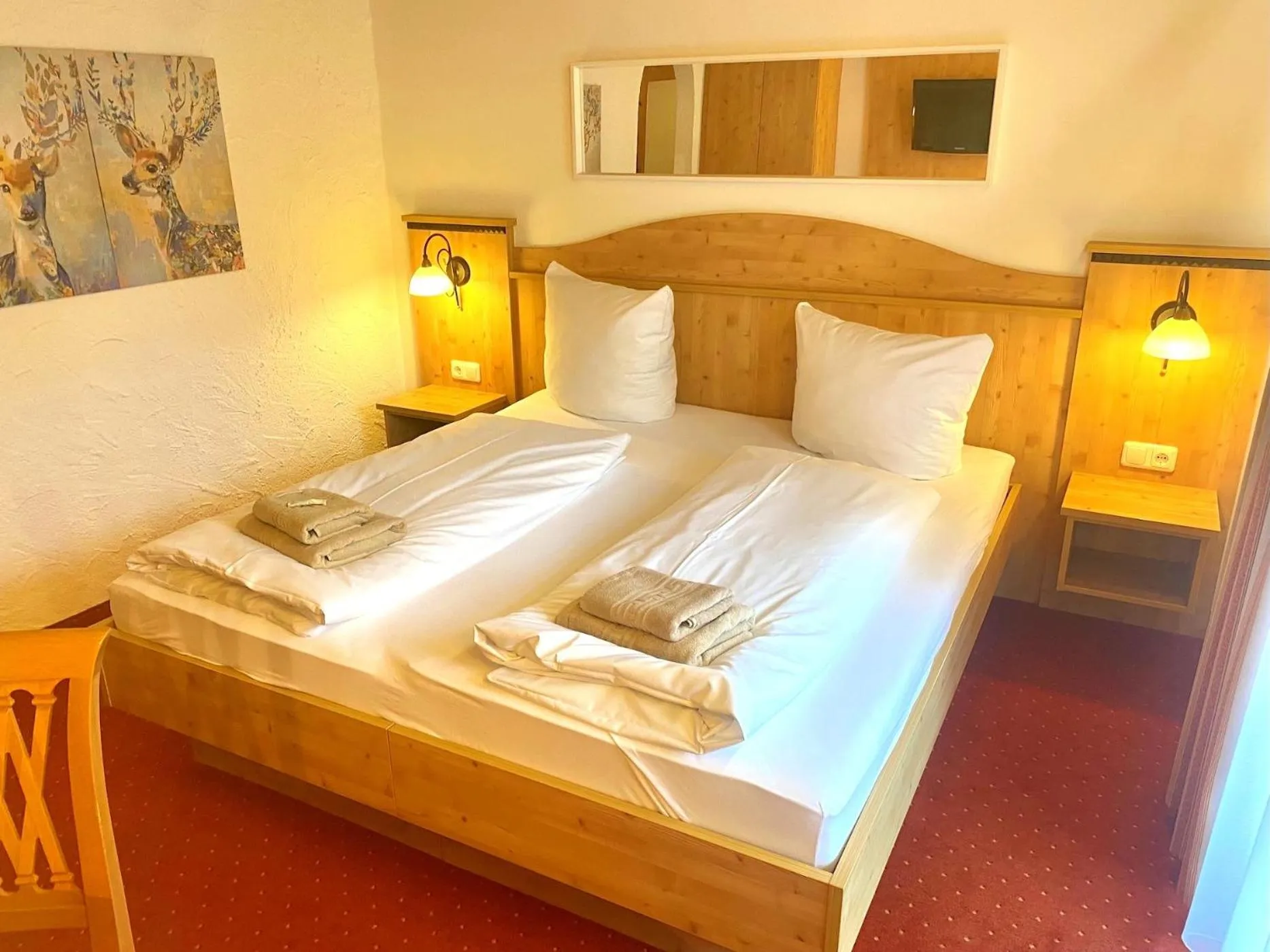Bed in Das Maximilian - Feines Landhotel am Schliersee