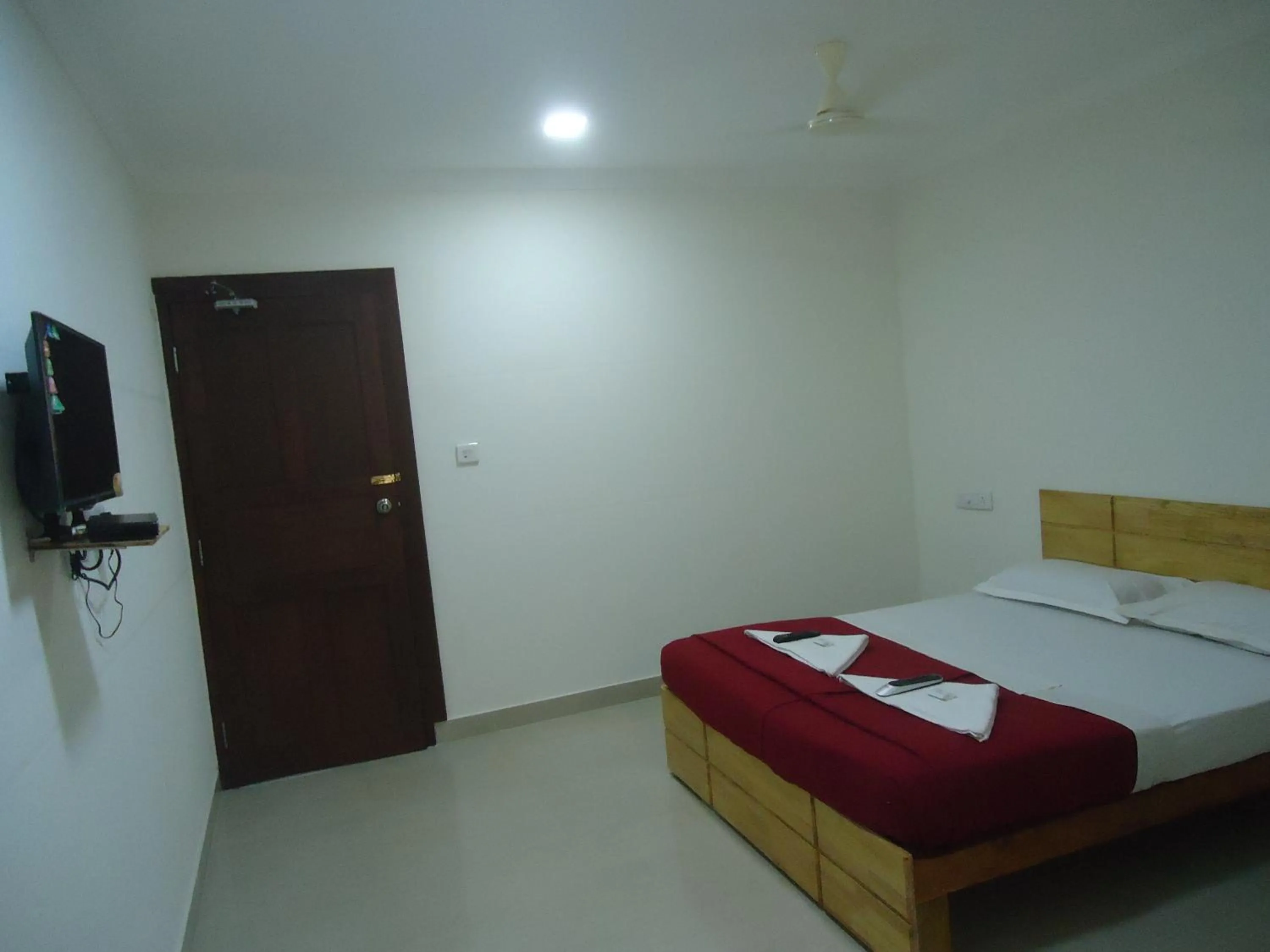 Photo of the whole room, Bed in A V Residency