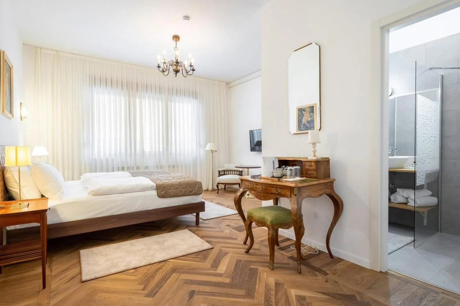 Photo of the whole room, Bed in Nobel Boutique