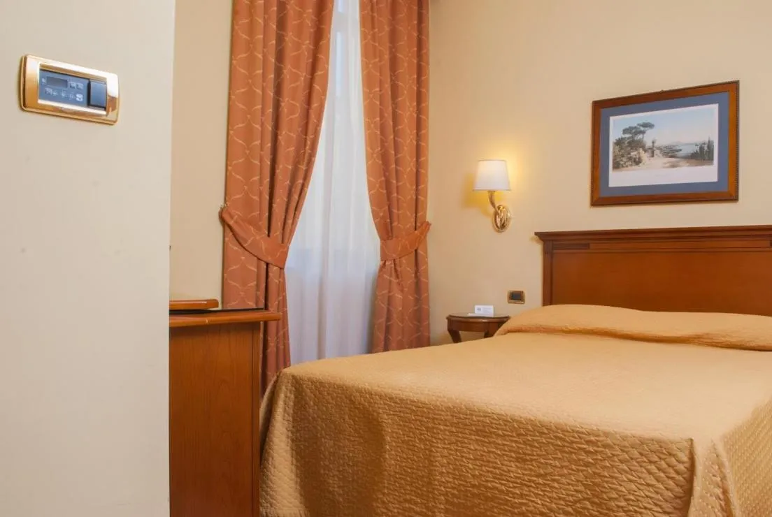 Bed in Le Cheminée Business Hotel Napoli