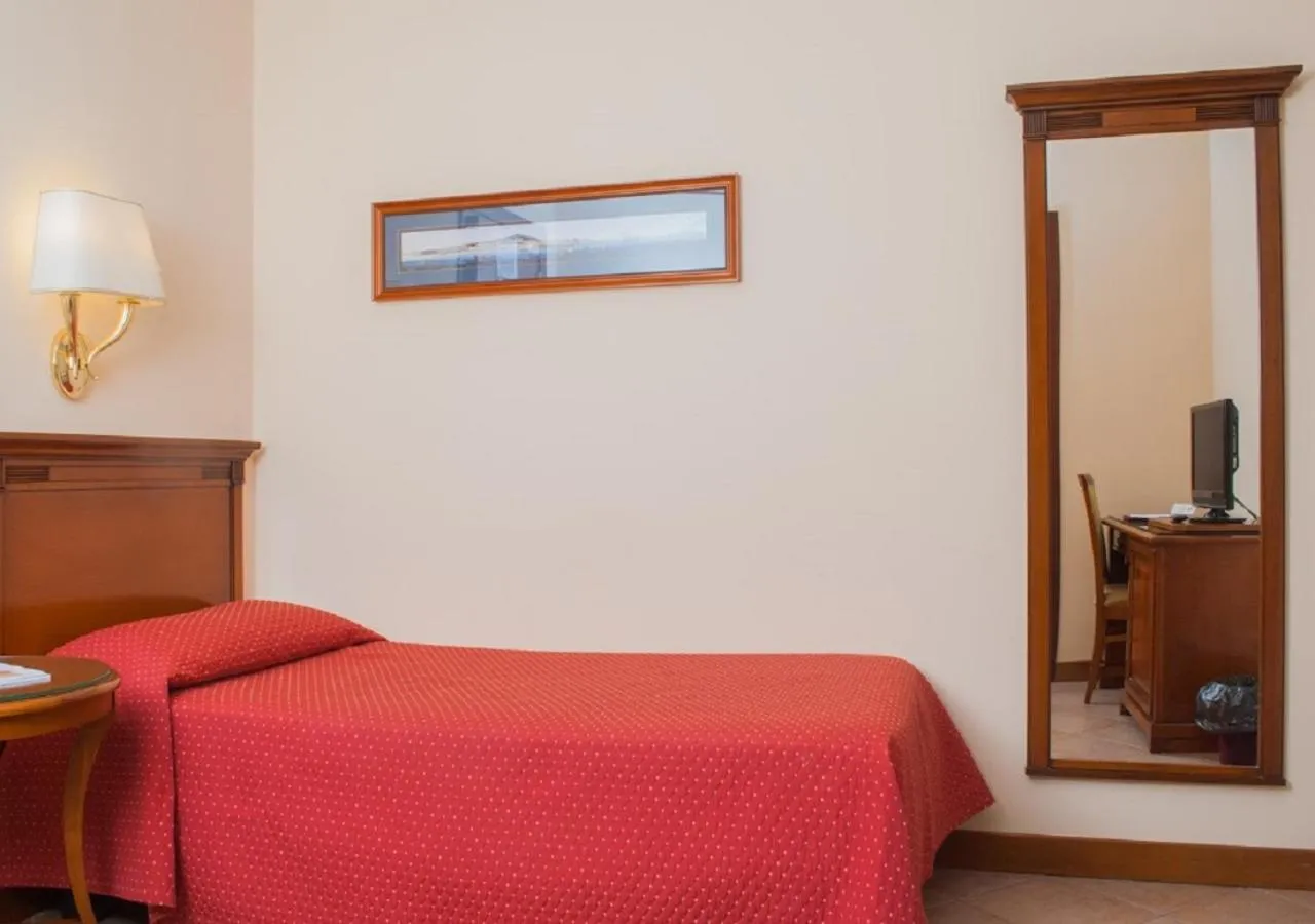 Bed in Le Cheminée Business Hotel Napoli