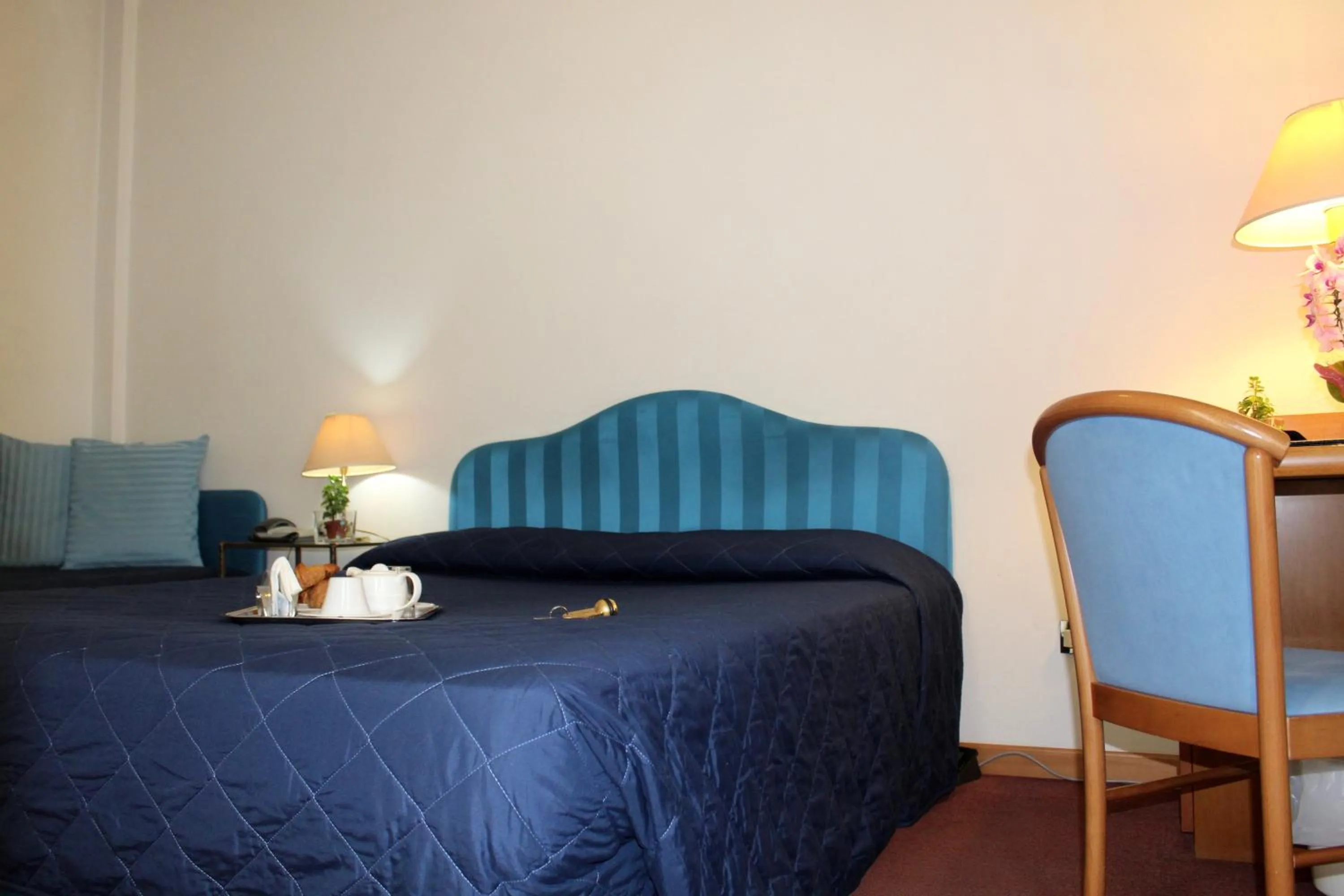 Bed in Arcangelo Roof Hotel