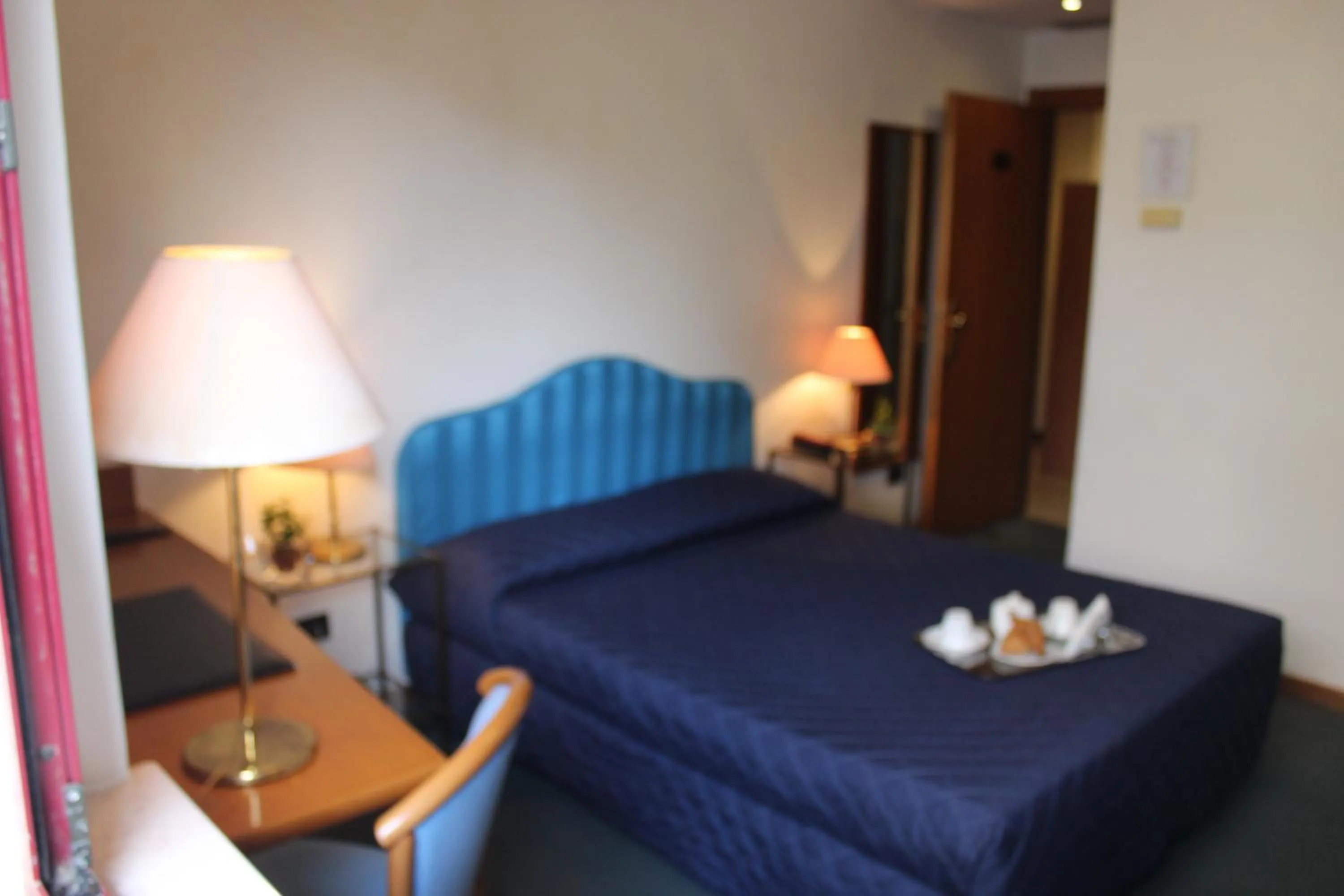 Bed in Arcangelo Roof Hotel