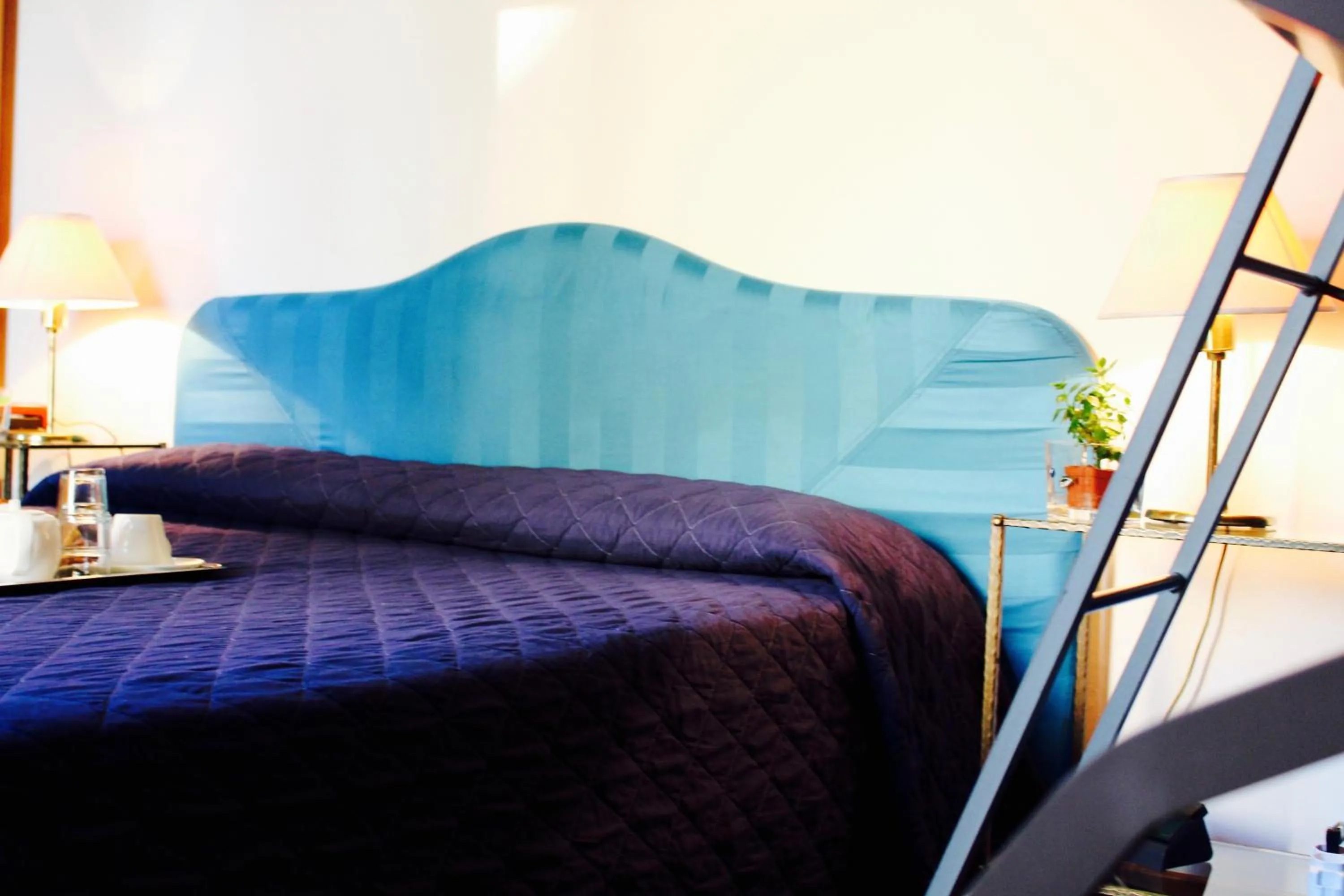 Bed in Arcangelo Roof Hotel