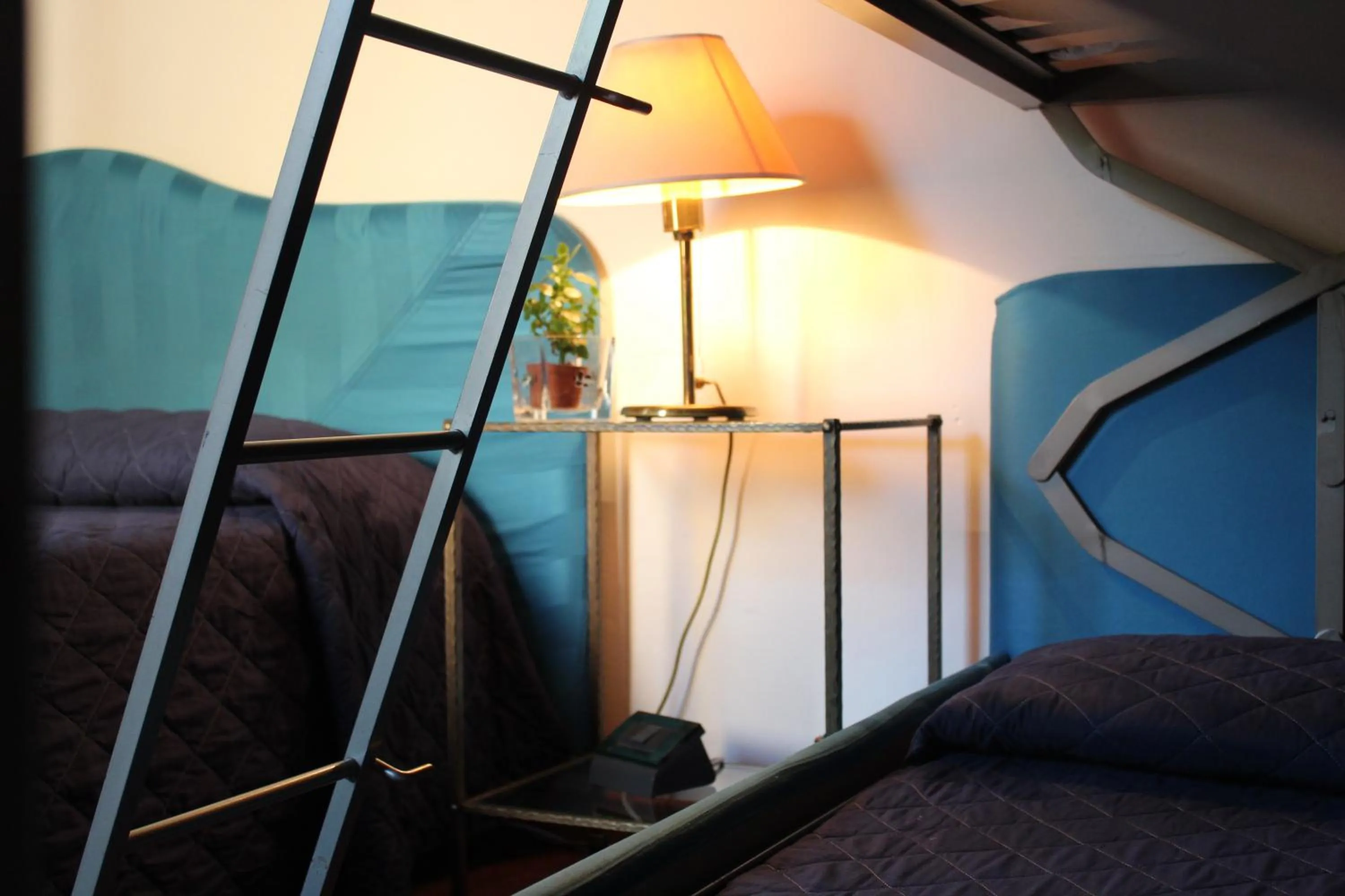 Bed in Arcangelo Roof Hotel