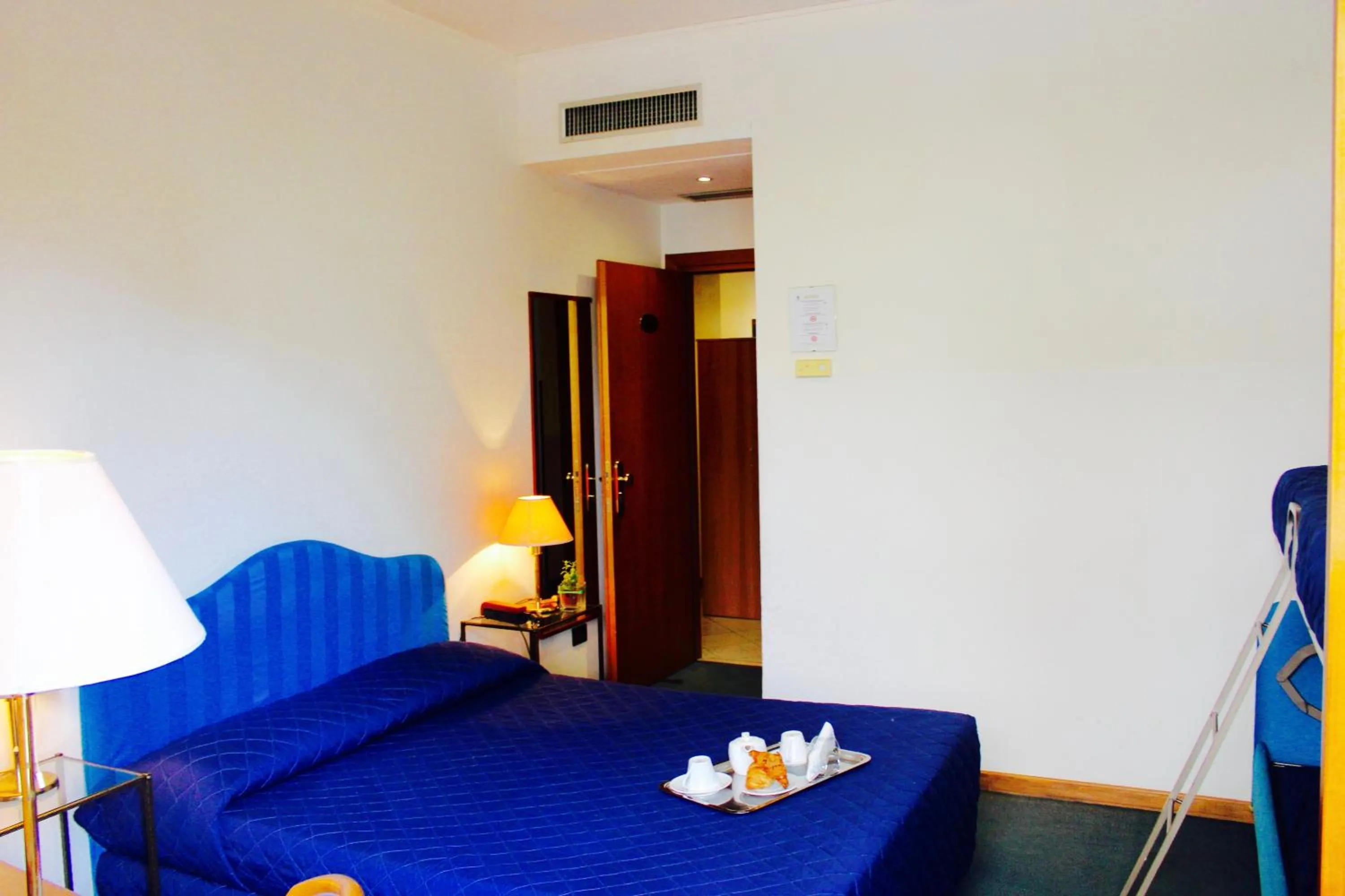 Bed in Arcangelo Roof Hotel