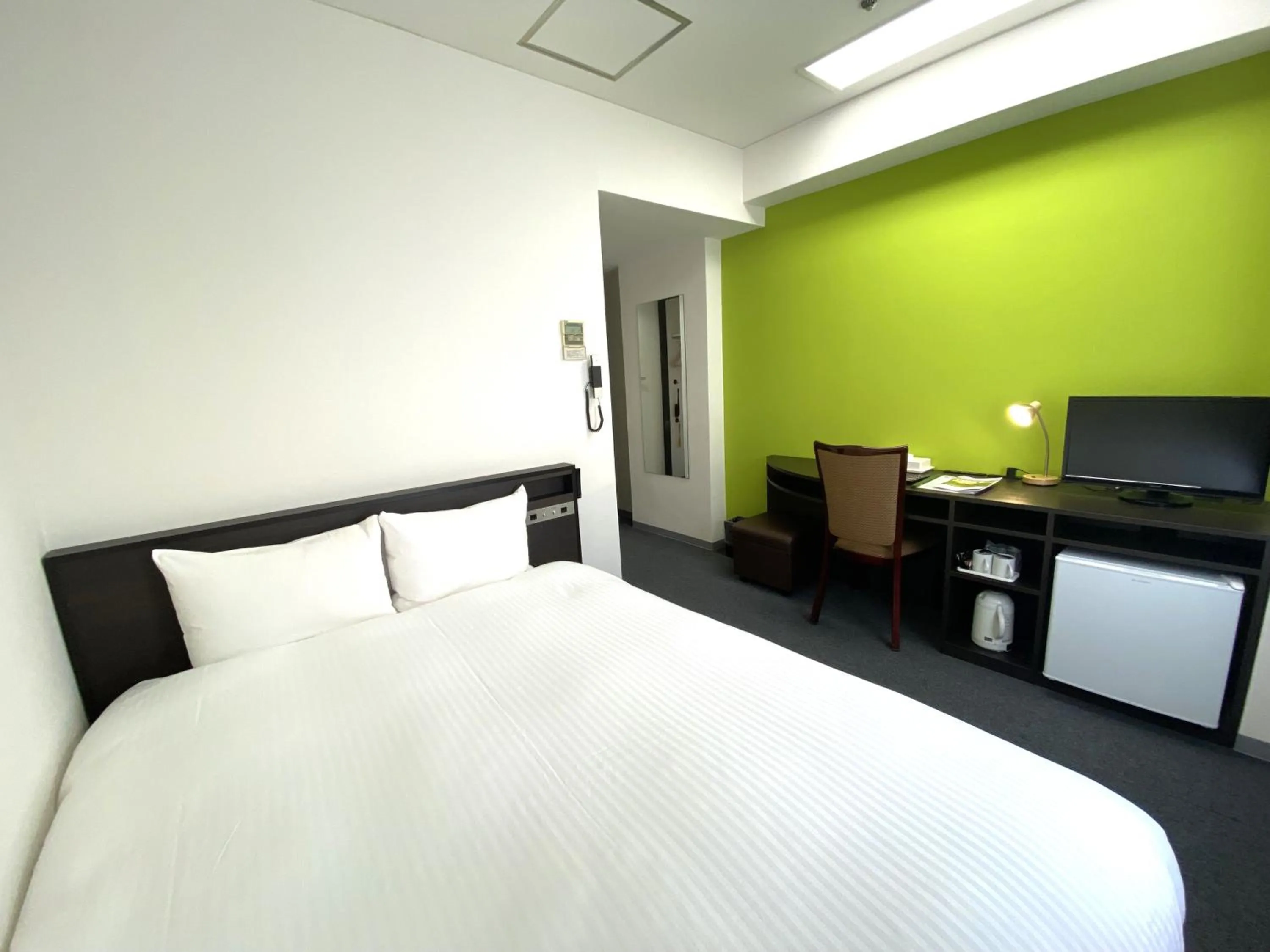 Bed in Hotel Continental Fuchu