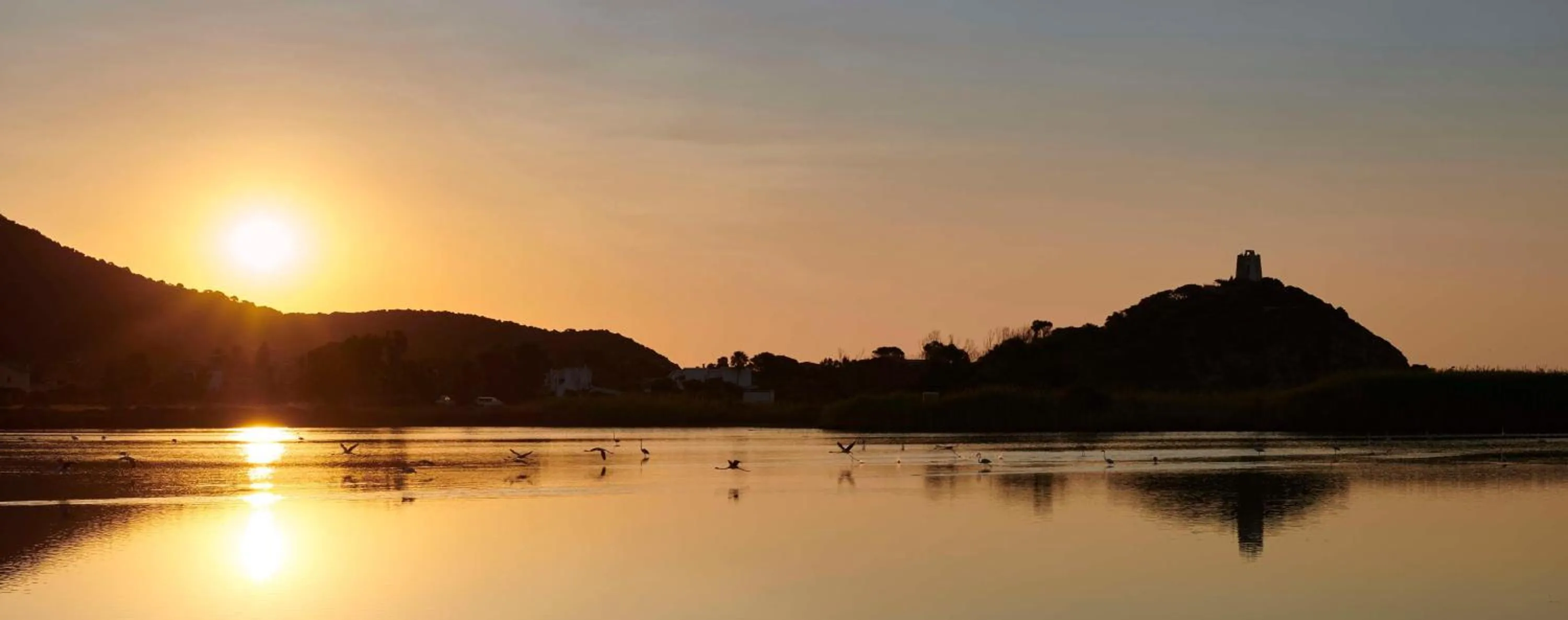 Property building in Baia Di Chia Resort Sardinia, Curio Collection By Hilton