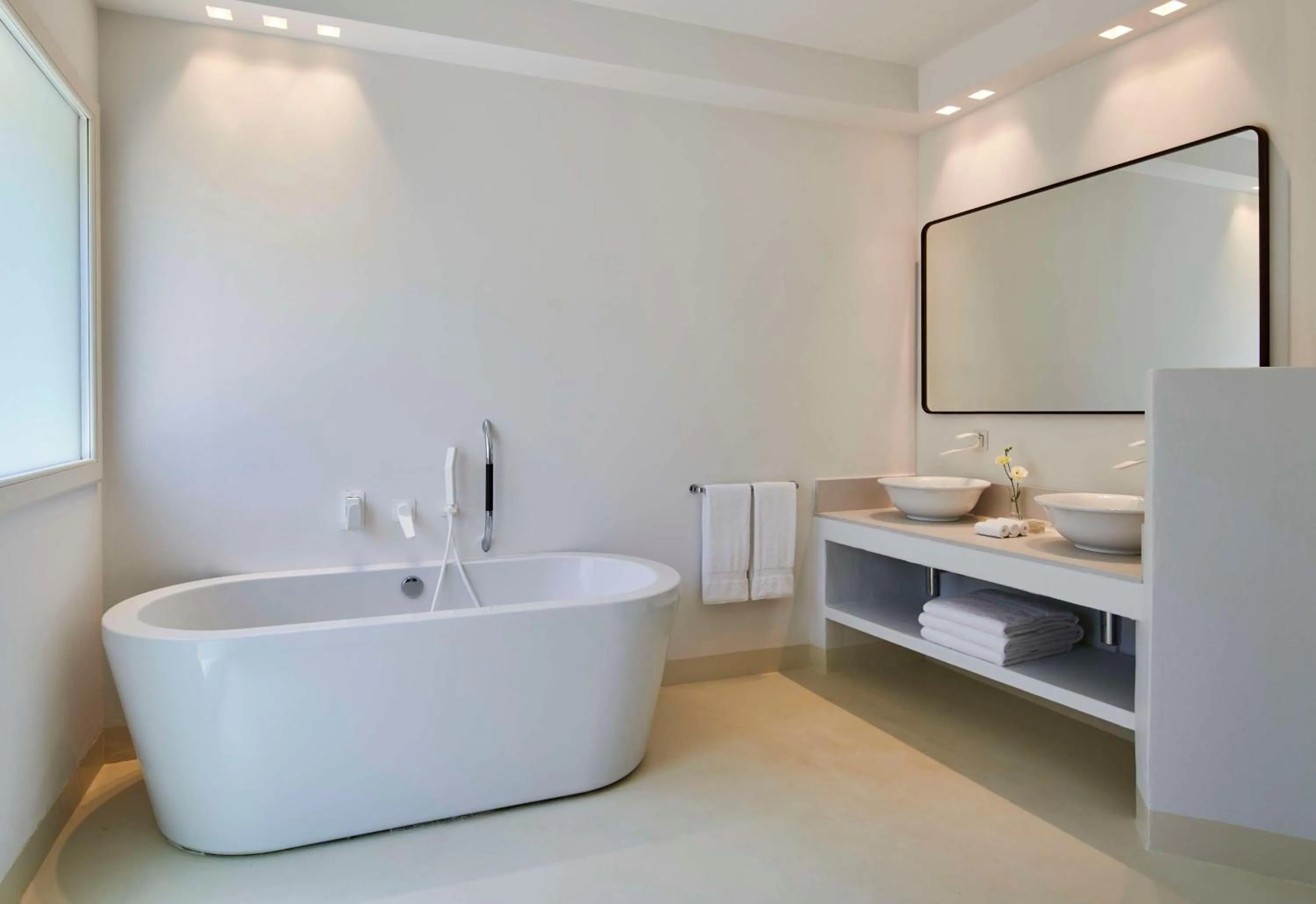 Bathroom in Baia Di Chia Resort Sardinia, Curio Collection By Hilton