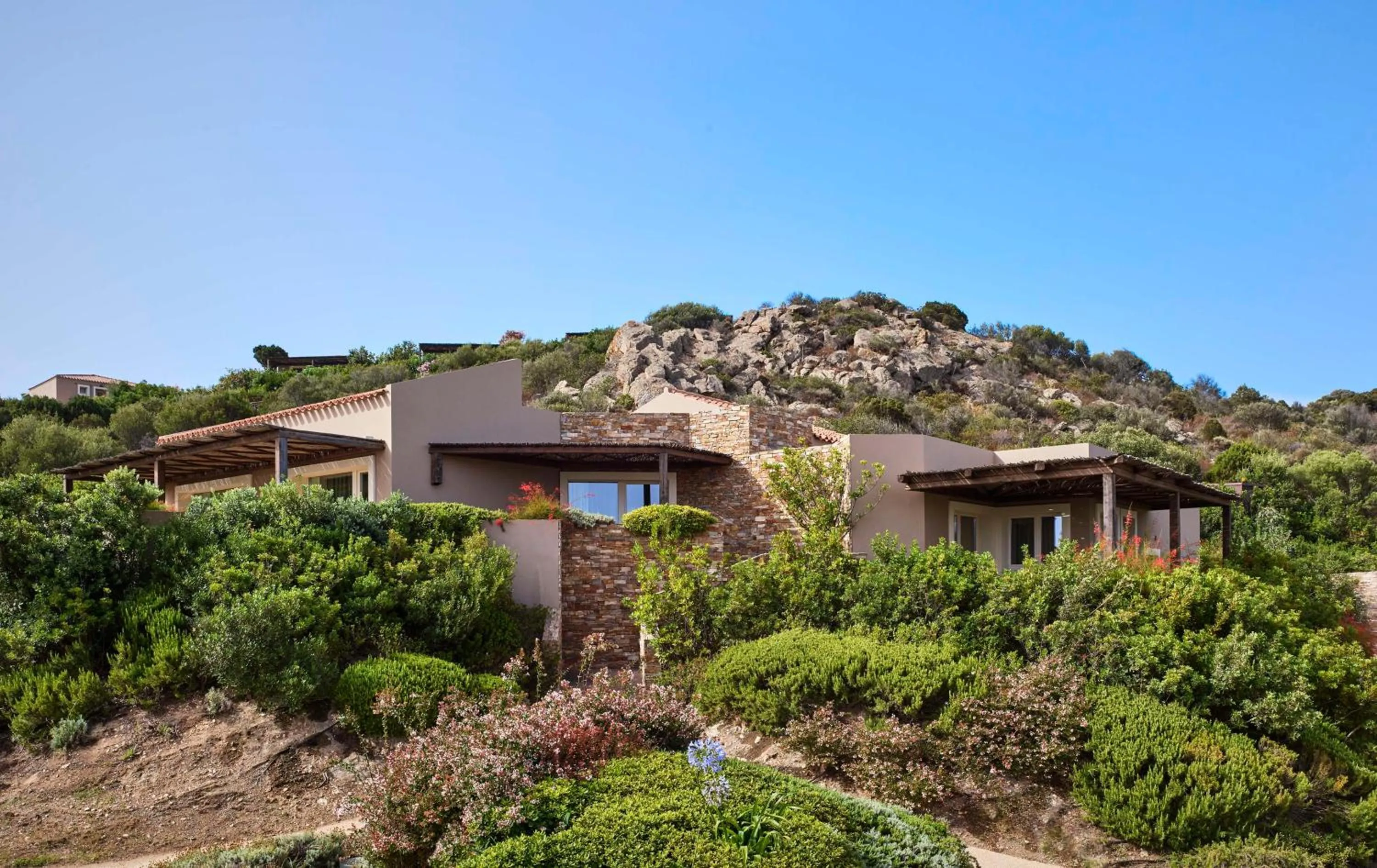 Photo of the whole room in Baia Di Chia Resort Sardinia, Curio Collection By Hilton