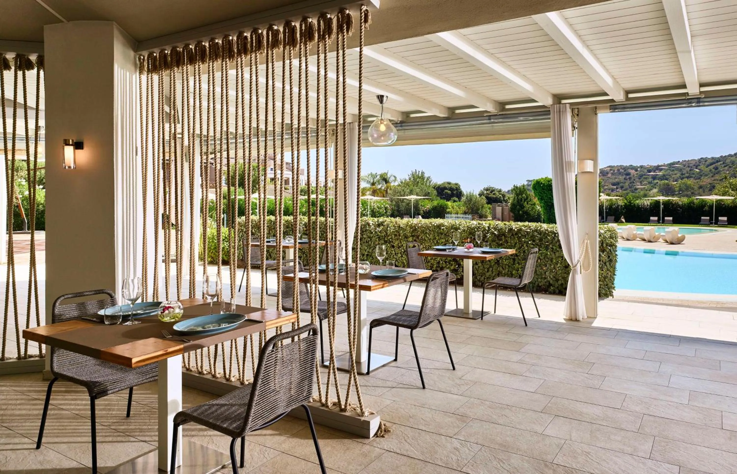 Restaurant/places to eat in Baia Di Chia Resort Sardinia, Curio Collection By Hilton