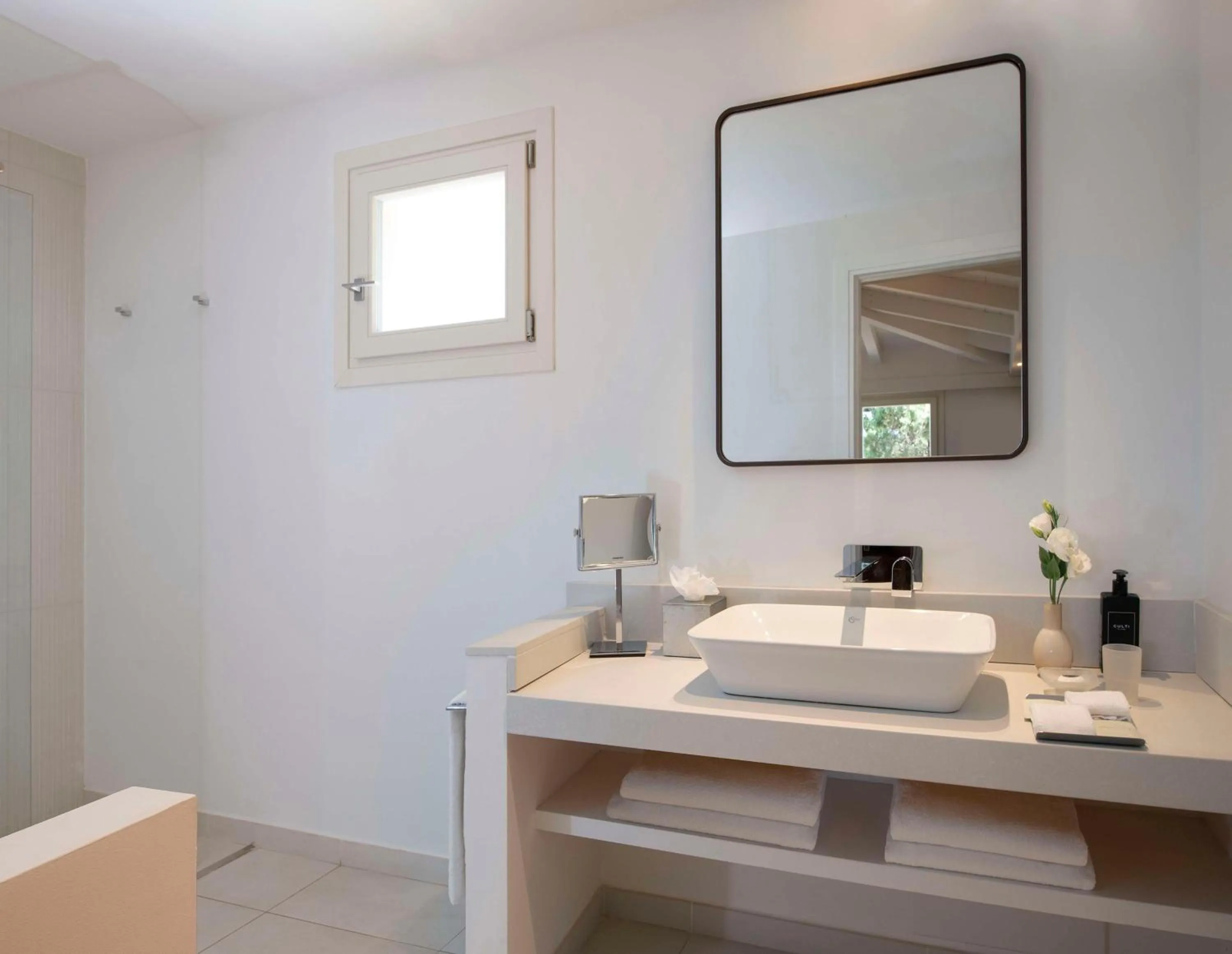 Bathroom in Baia Di Chia Resort Sardinia, Curio Collection By Hilton