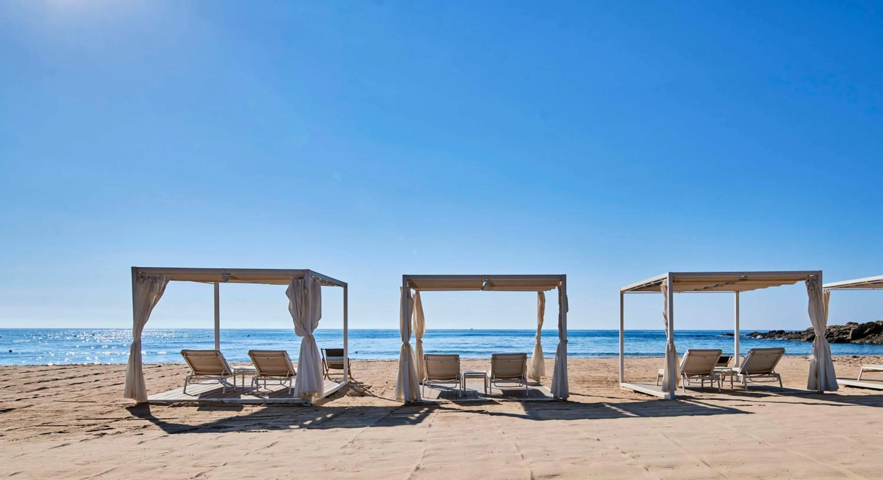 Property building in Baia Di Chia Resort Sardinia, Curio Collection By Hilton