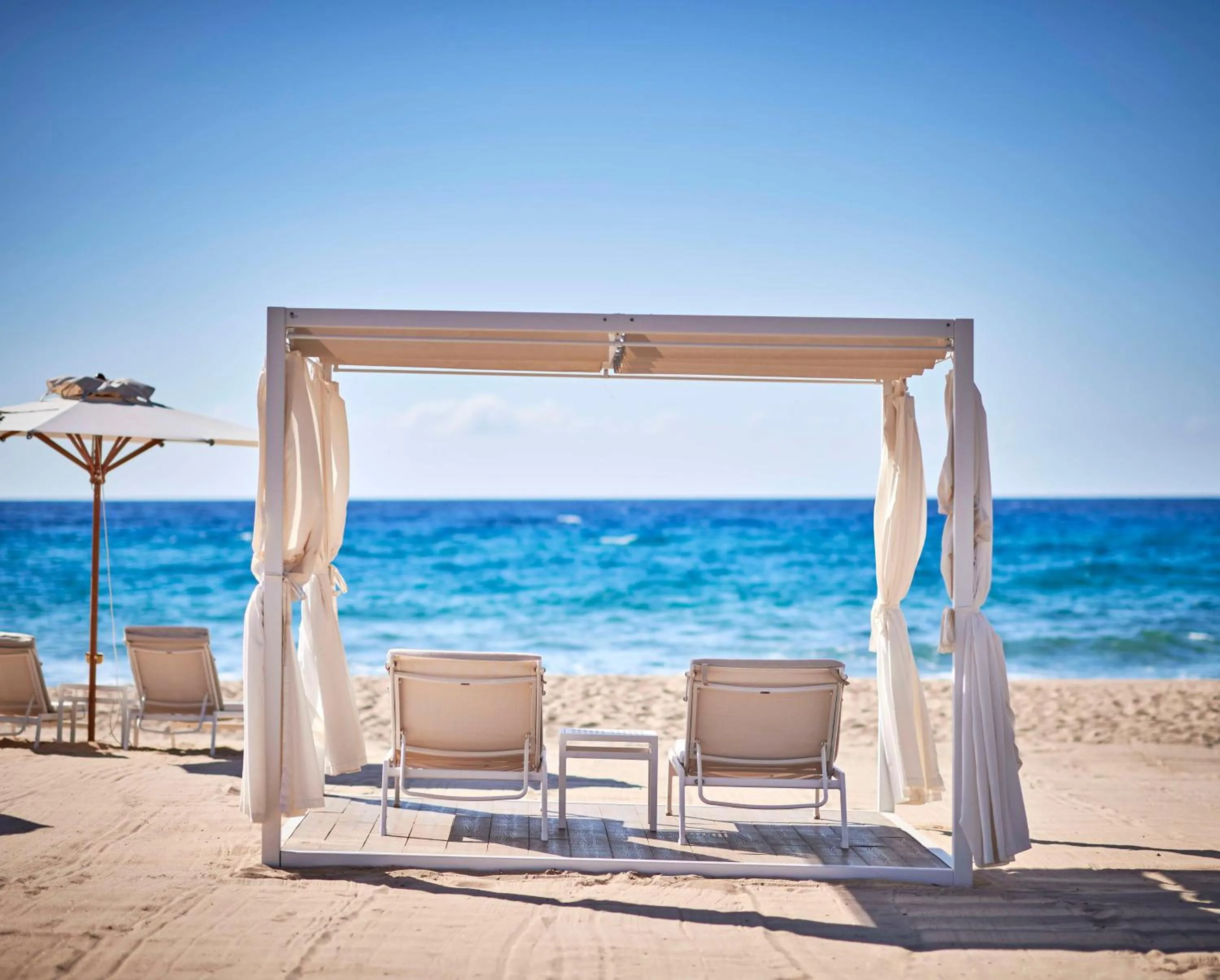 Property building in Baia Di Chia Resort Sardinia, Curio Collection By Hilton