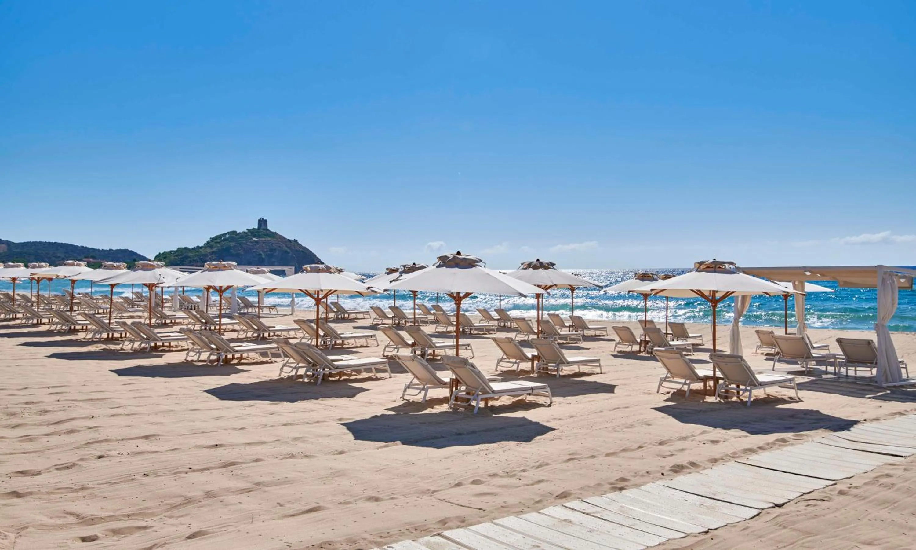 Property building in Baia Di Chia Resort Sardinia, Curio Collection By Hilton