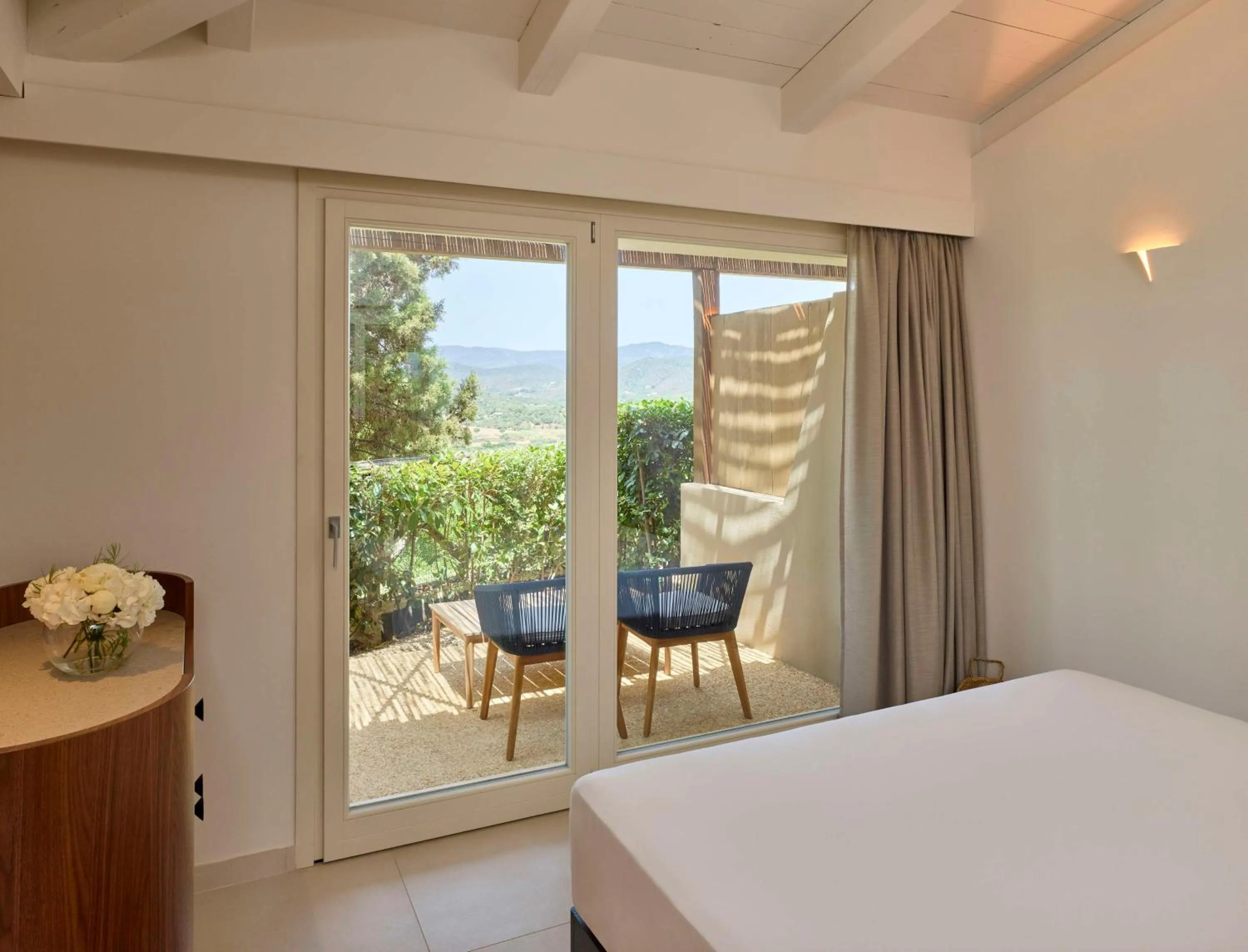 Bed in Baia Di Chia Resort Sardinia, Curio Collection By Hilton
