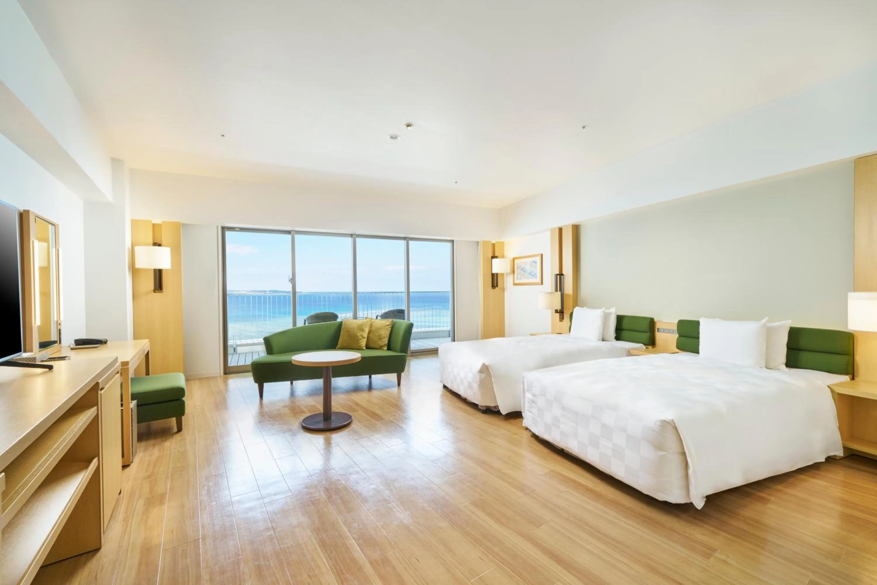 Bed in The Orion Hotel Motobu Resort & Spa