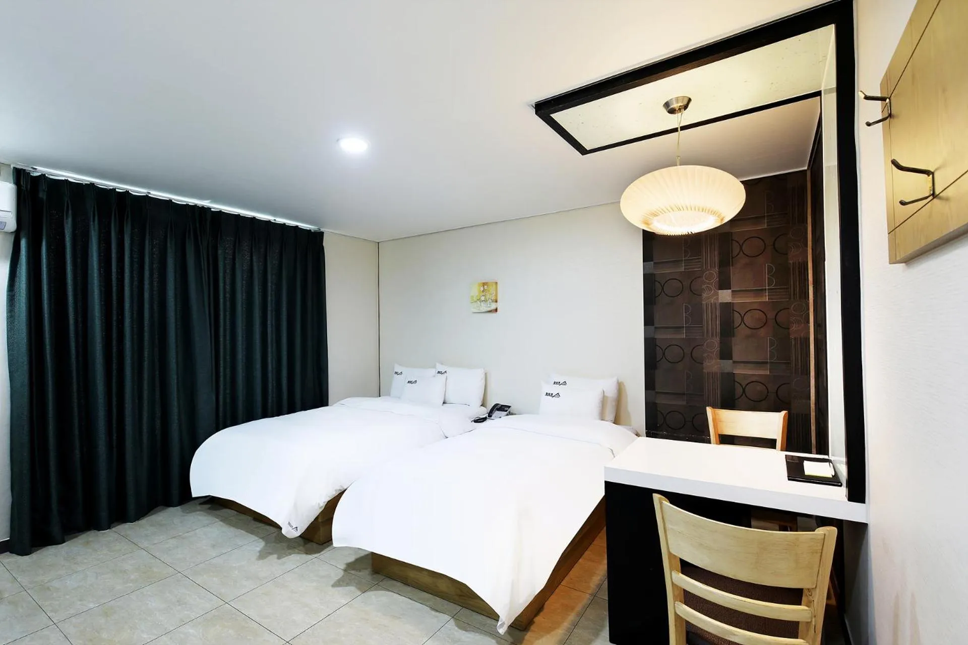 Bed in White Tourist Hotel