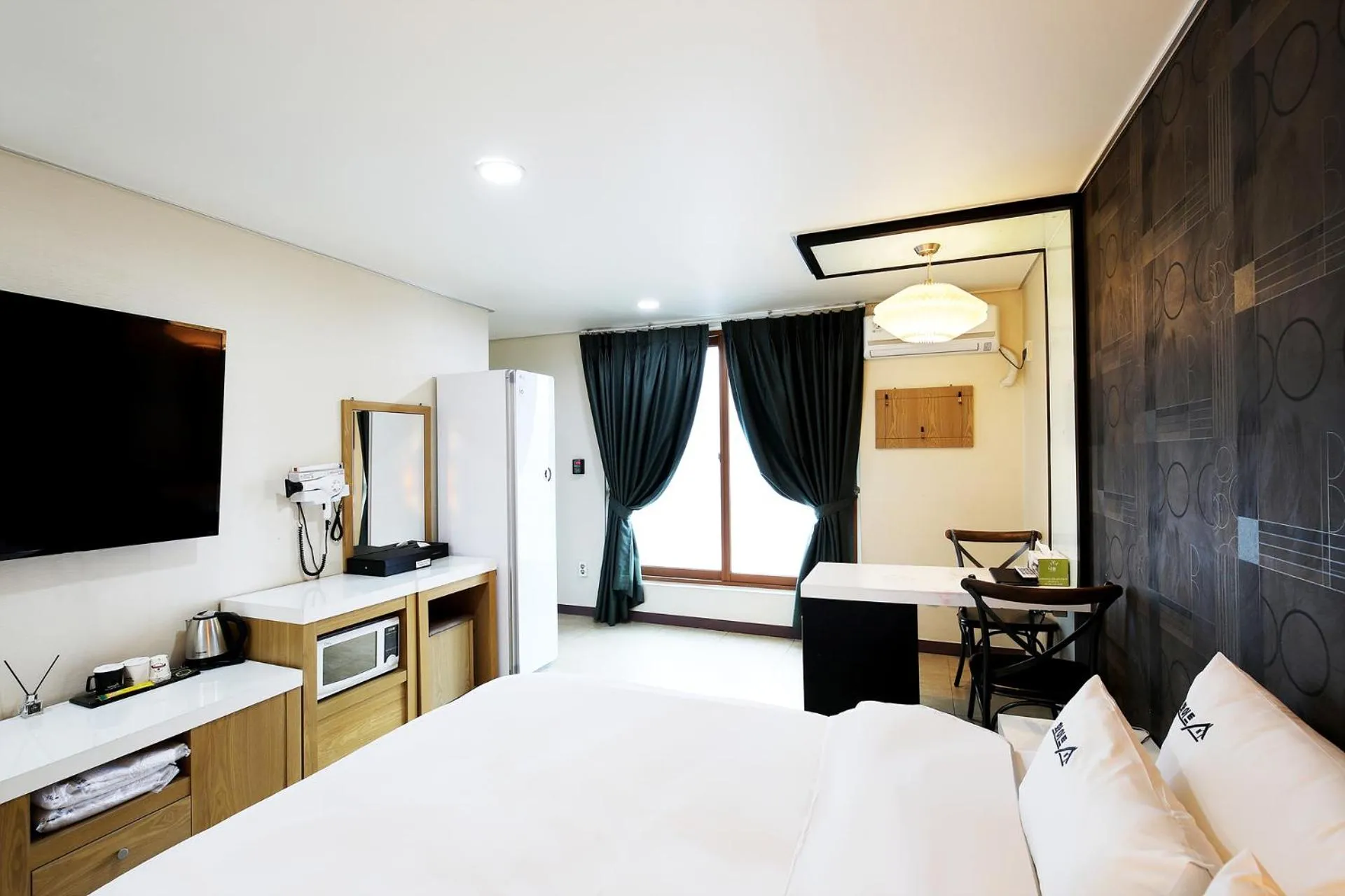 Bed in White Tourist Hotel