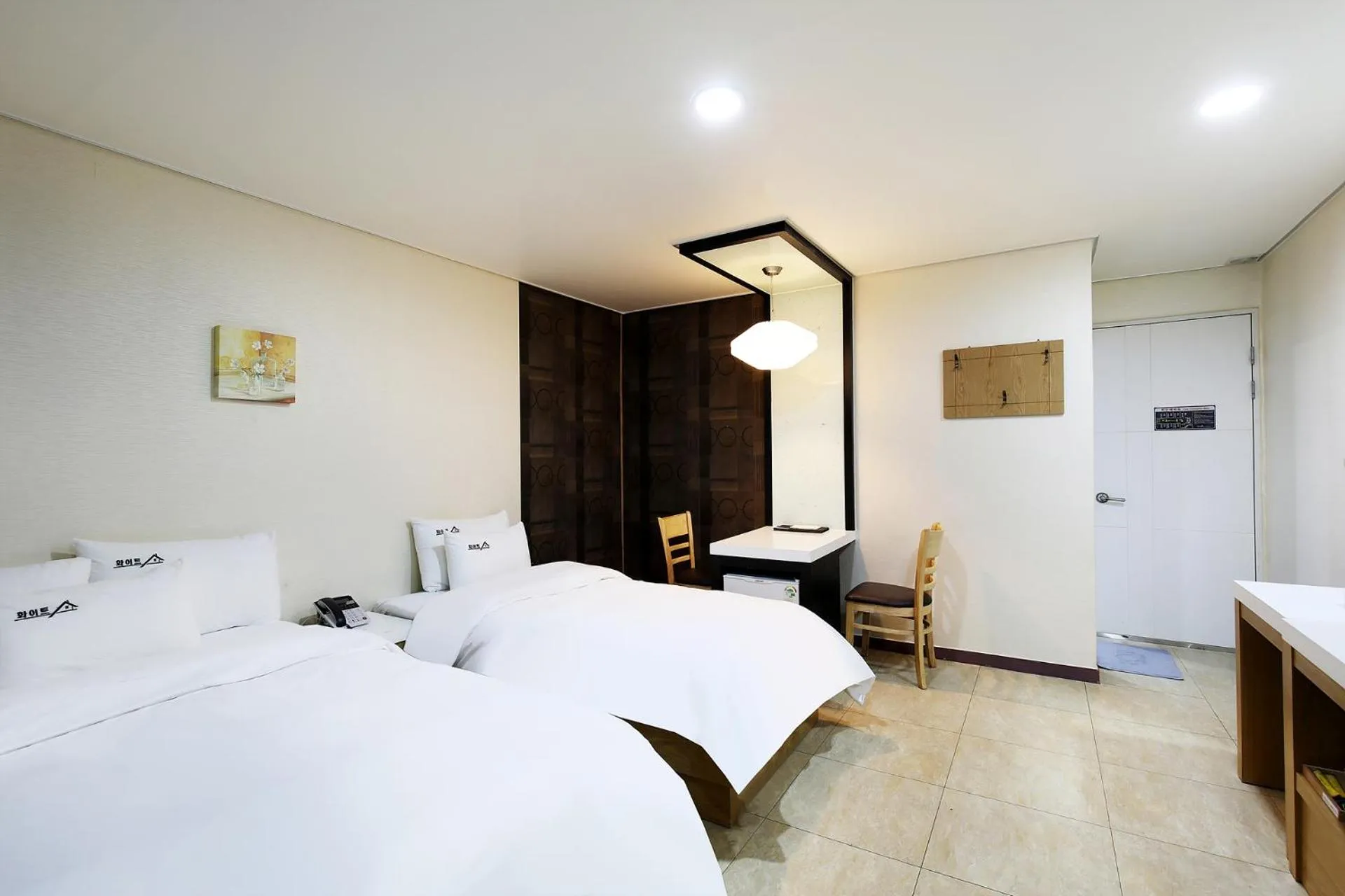 Bed in White Tourist Hotel