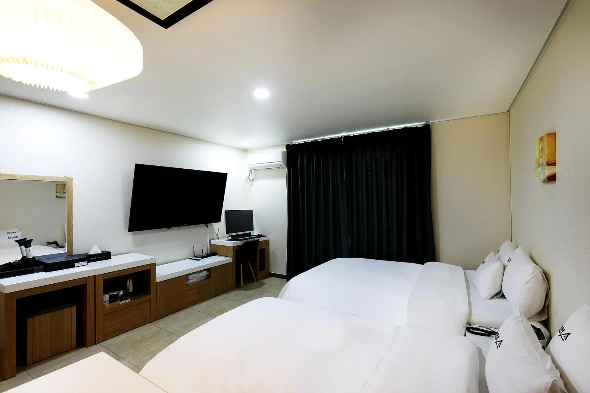 Bed in White Tourist Hotel