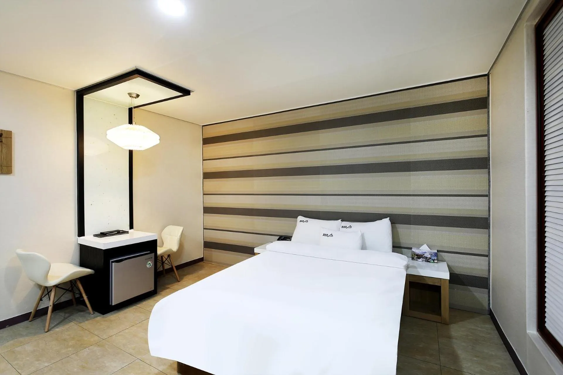 Bed in White Tourist Hotel