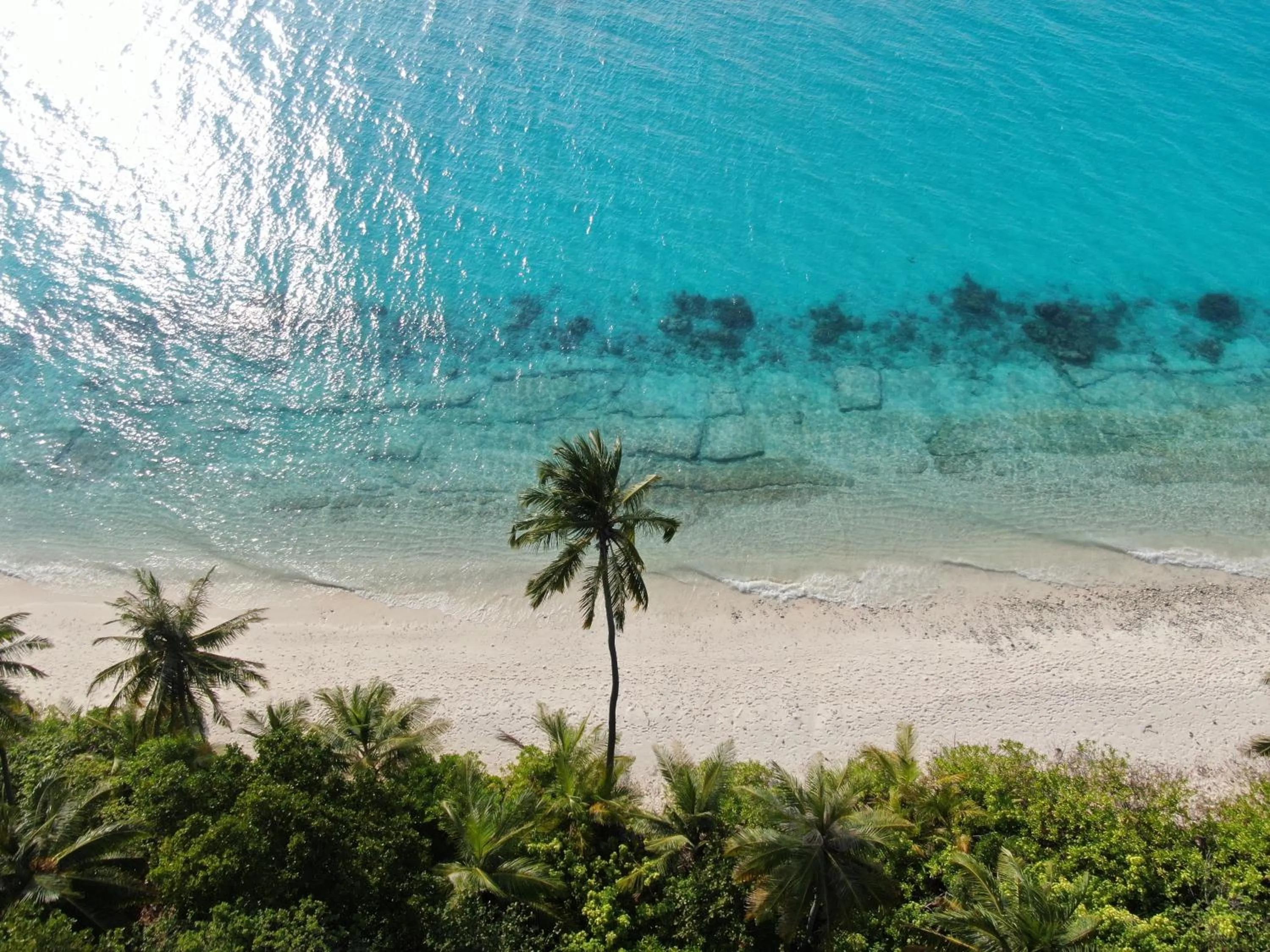 Sunrise by white sand dhigurah