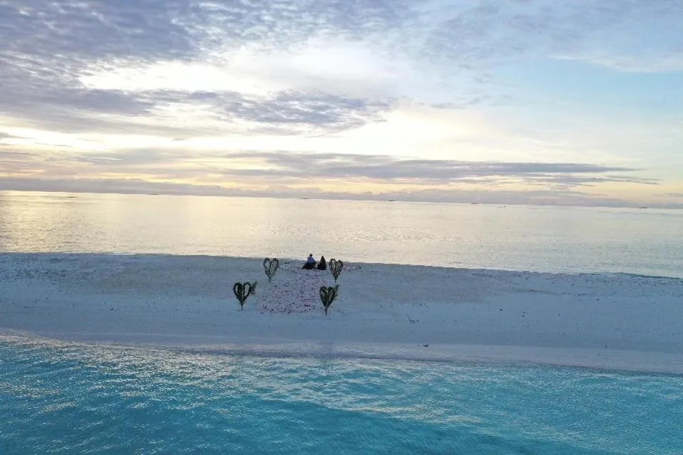 Sunrise by white sand dhigurah