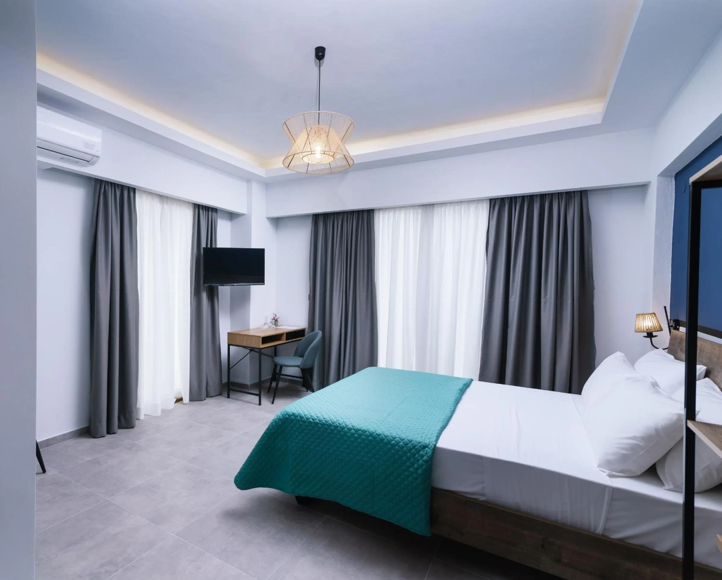 Bed in Alcyone Studios and Apartments