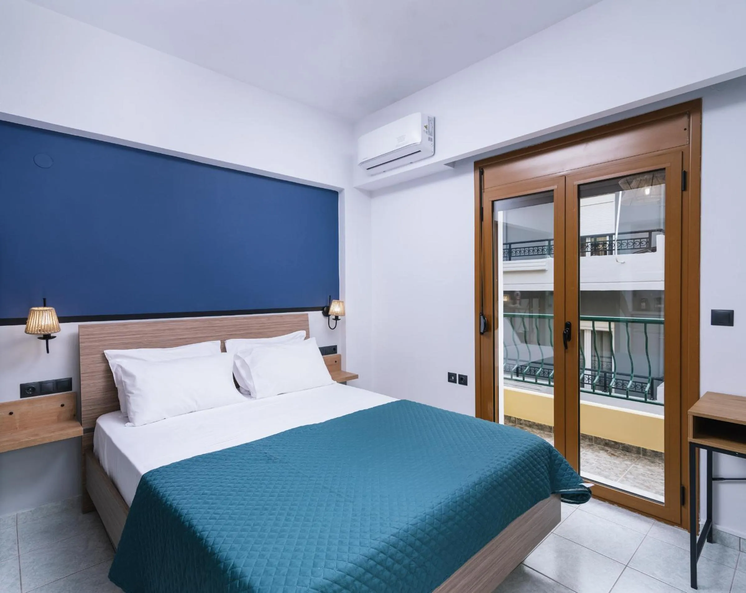 Bed in Alcyone Studios and Apartments