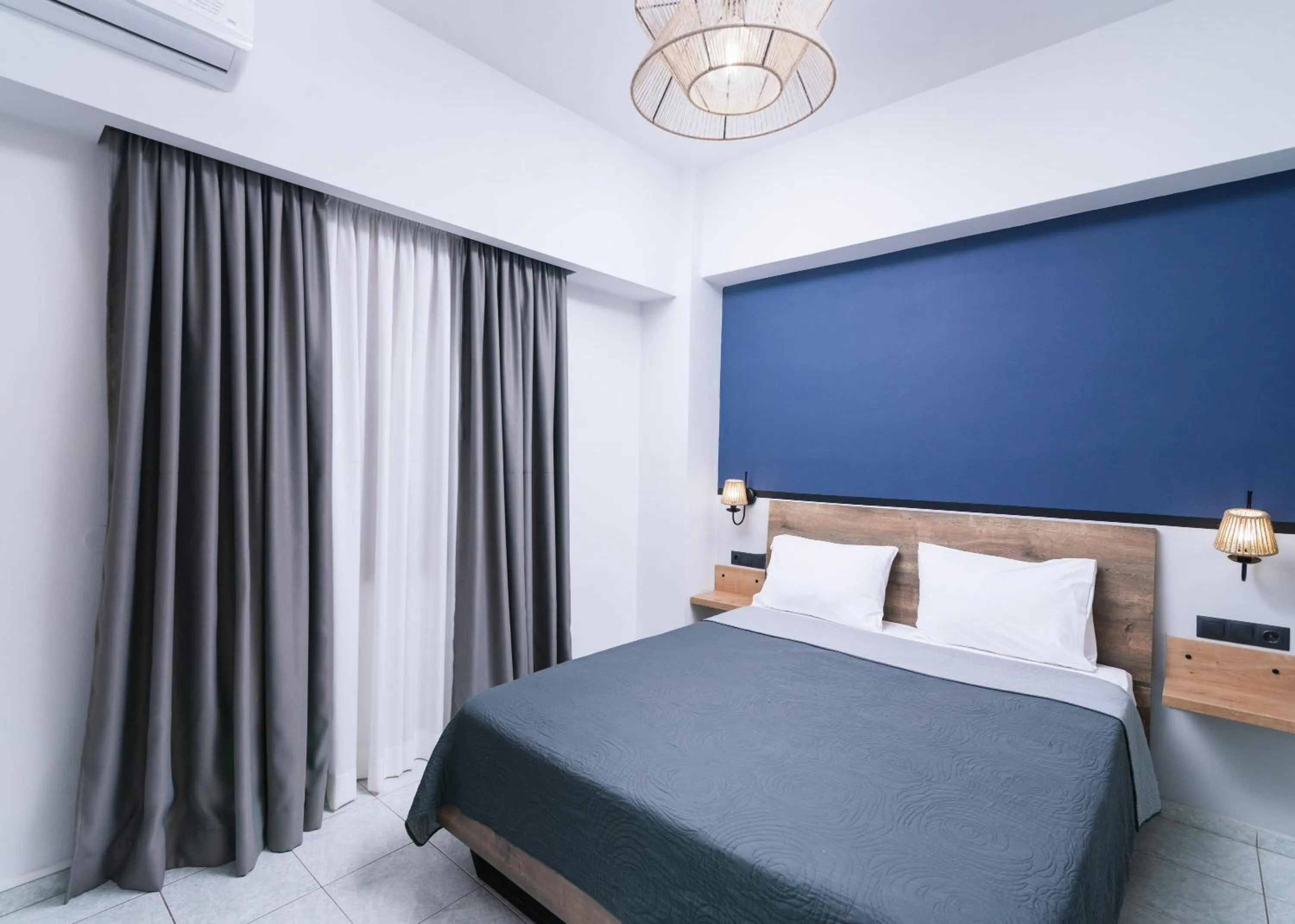 Bed in Alcyone Studios and Apartments