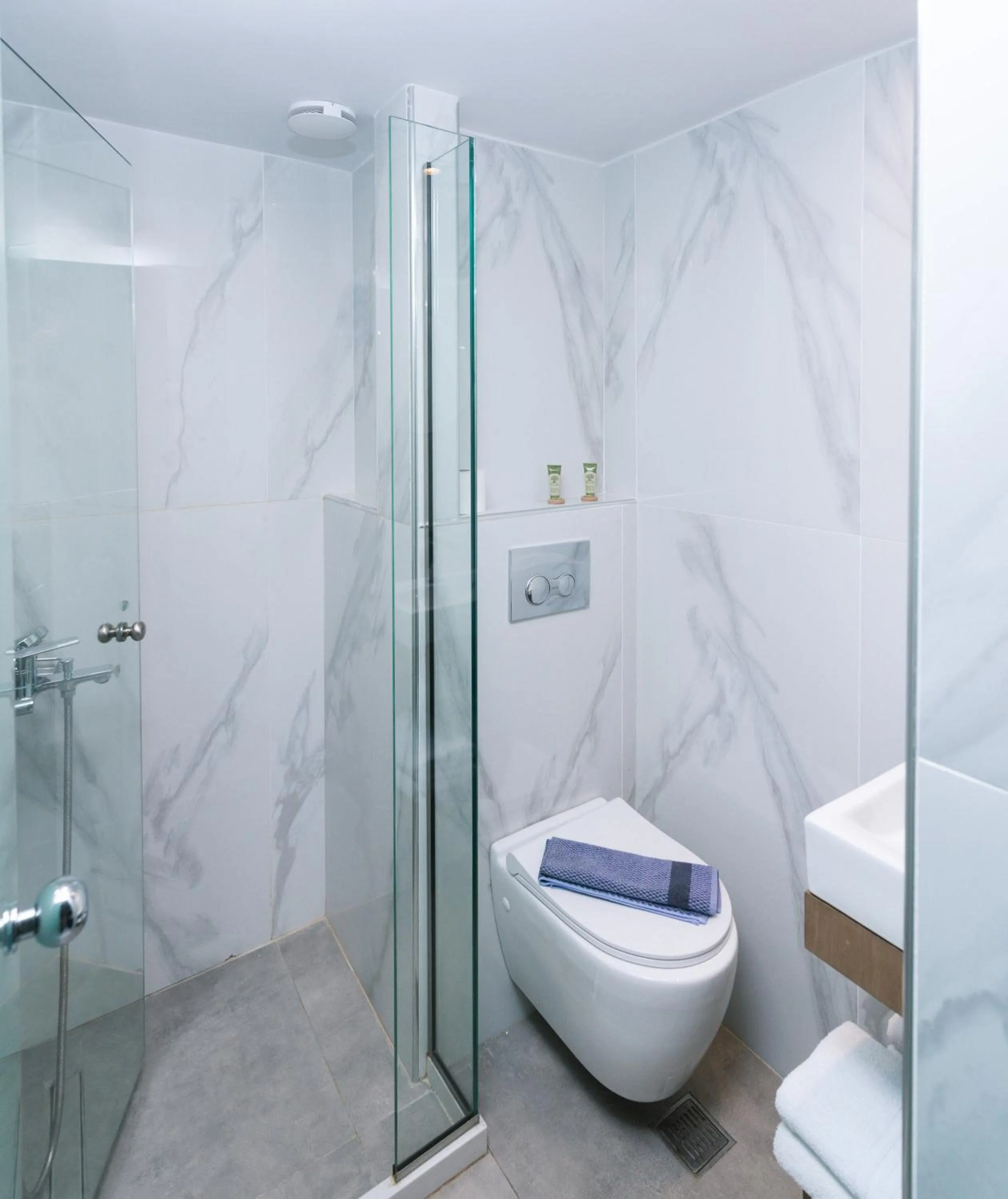 Shower in Alcyone Studios and Apartments