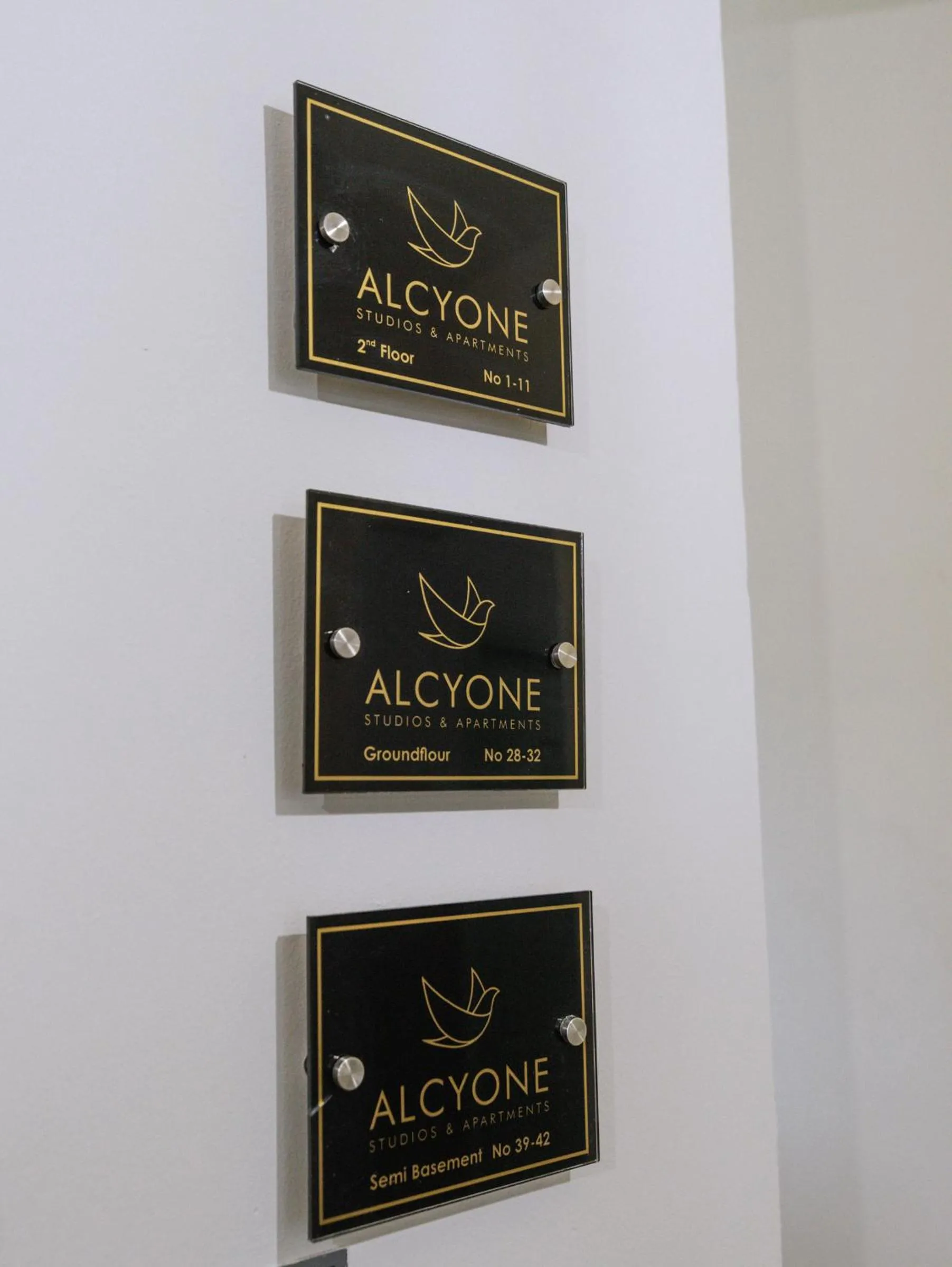 Property logo or sign in Alcyone Studios and Apartments