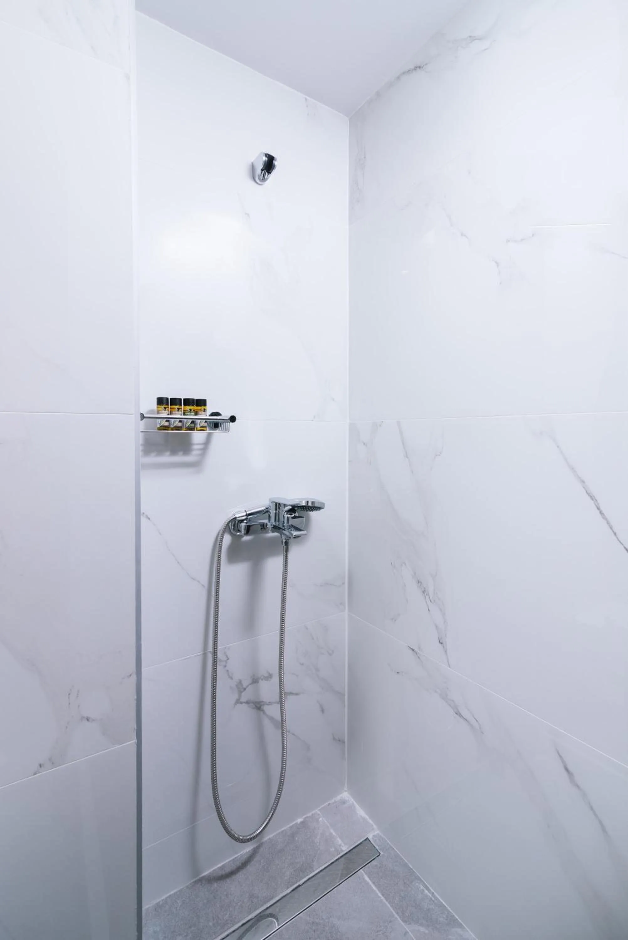 Shower in Alcyone Studios and Apartments