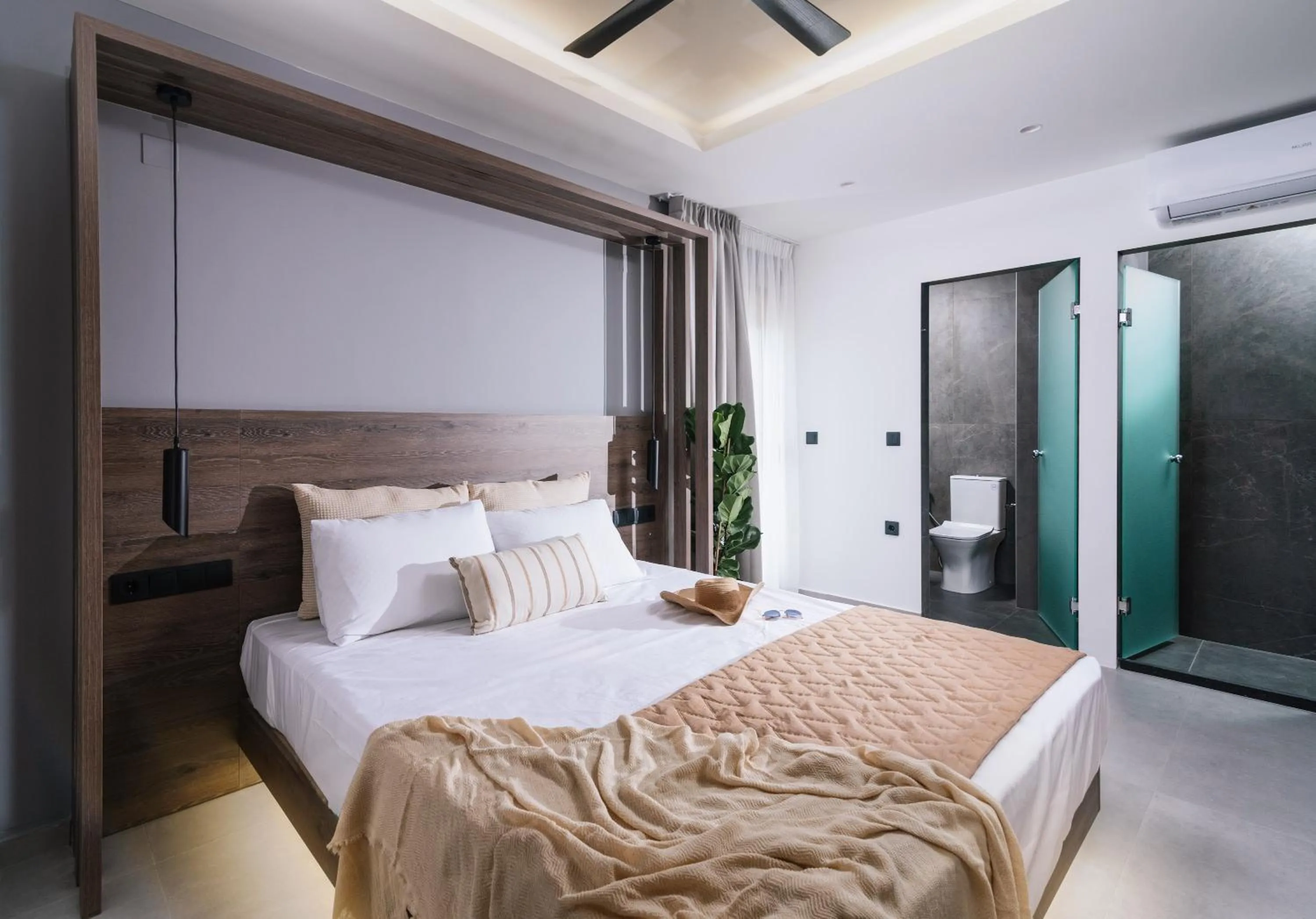 Bed in Alcyone Studios and Apartments