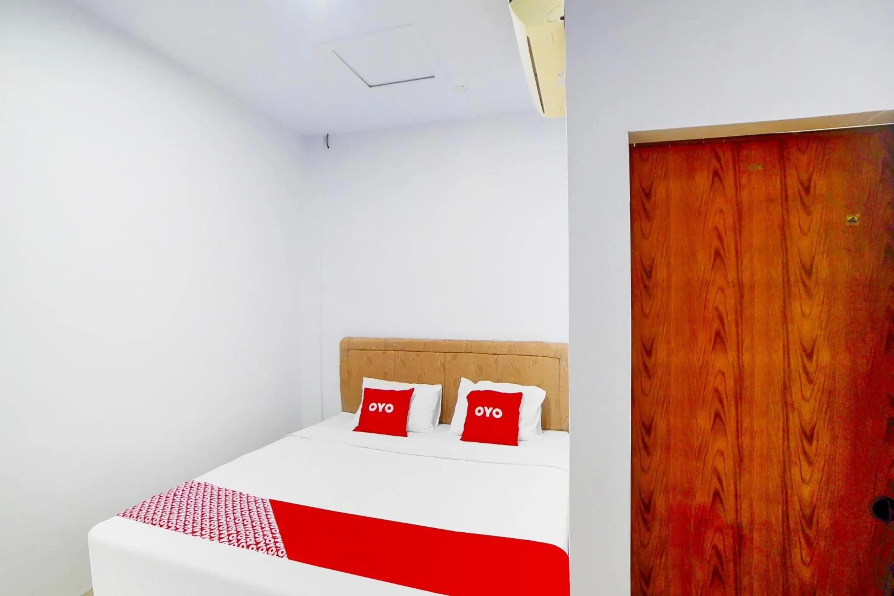 Bedroom in OYO 91283 Sg Premium Guest House