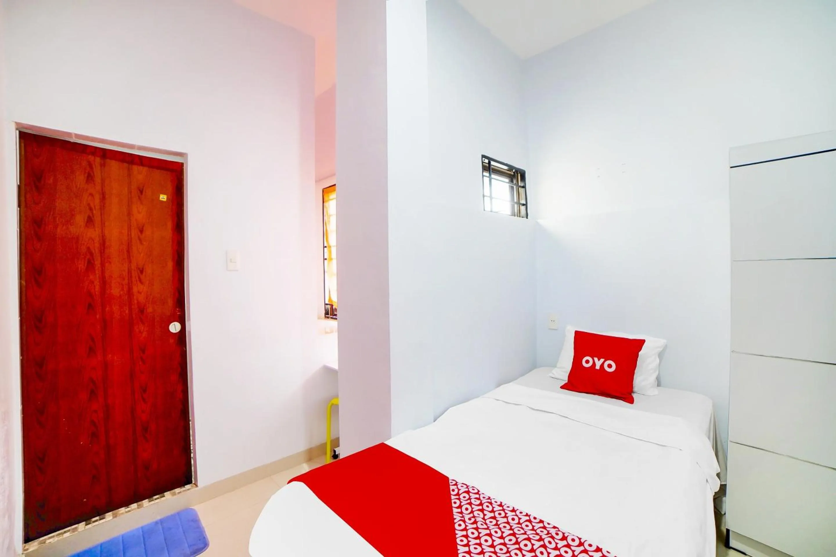 Bedroom in OYO 91283 Sg Premium Guest House