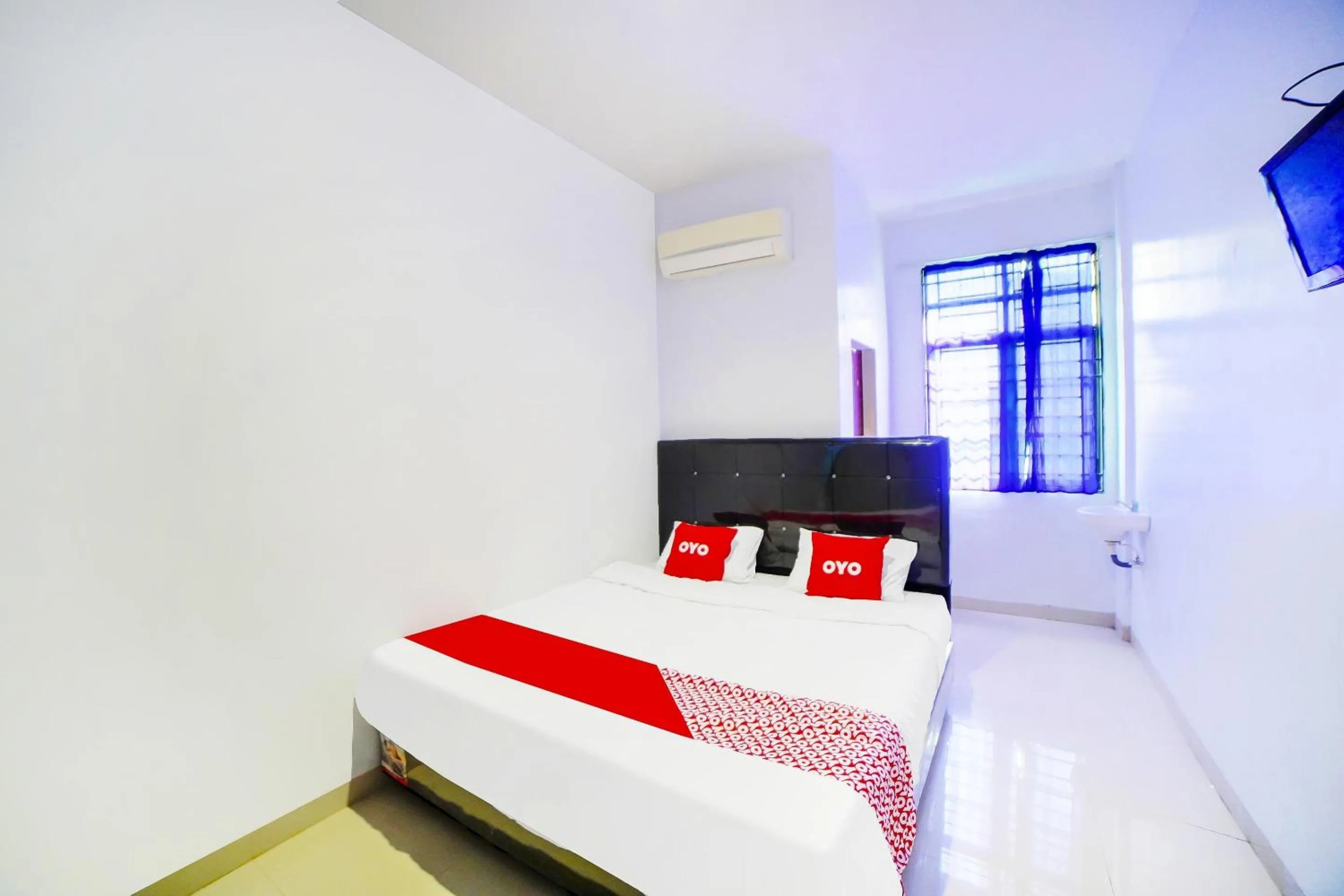 Bedroom in OYO 91283 Sg Premium Guest House