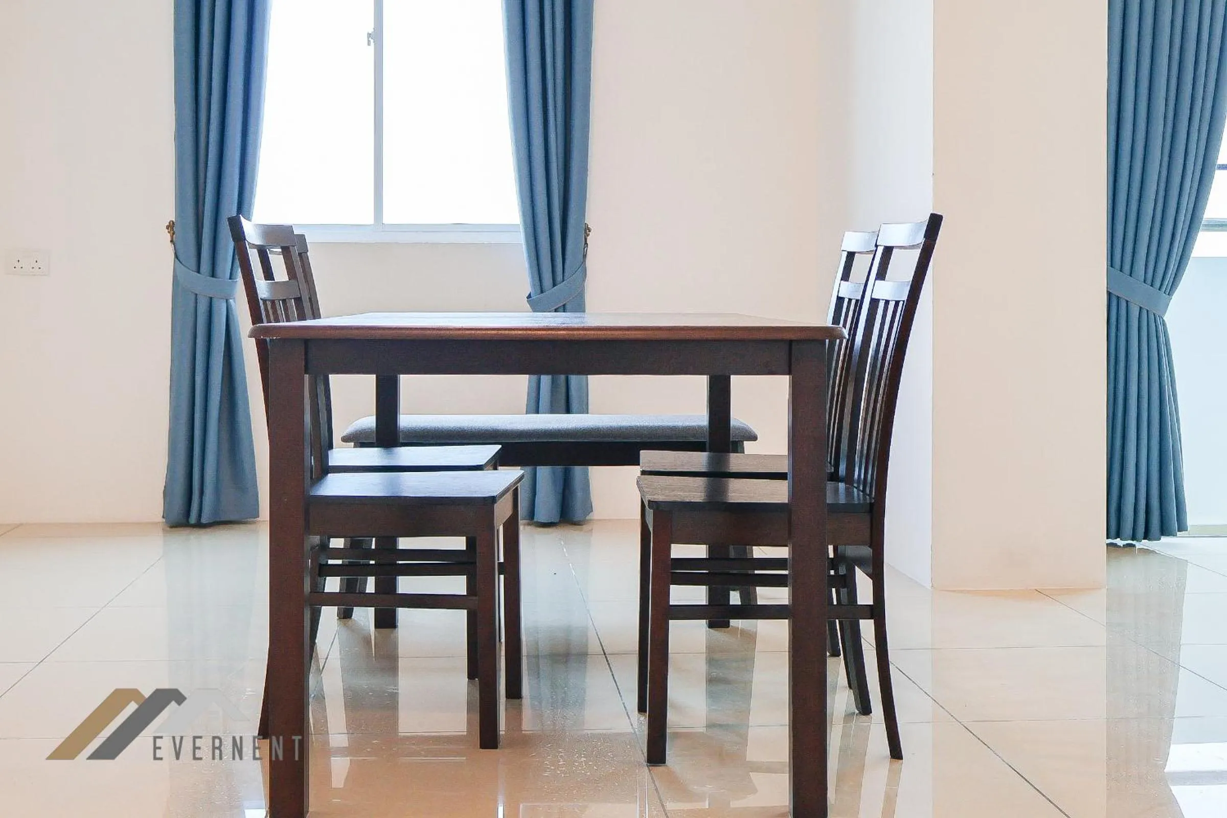 Dining area in Serene Heights by Evernent