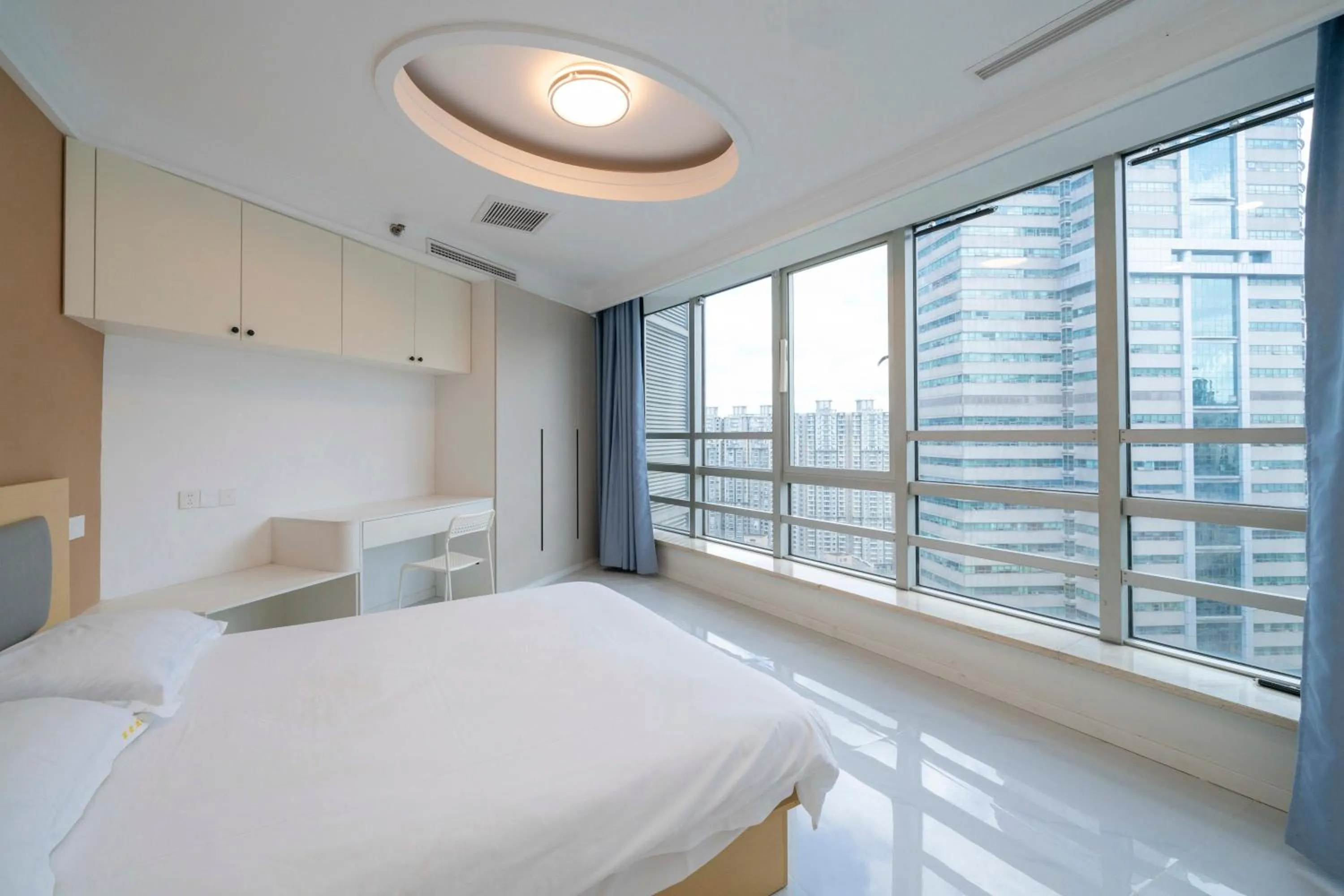 Bed in Shanghai Jiarong Hotel Apartment